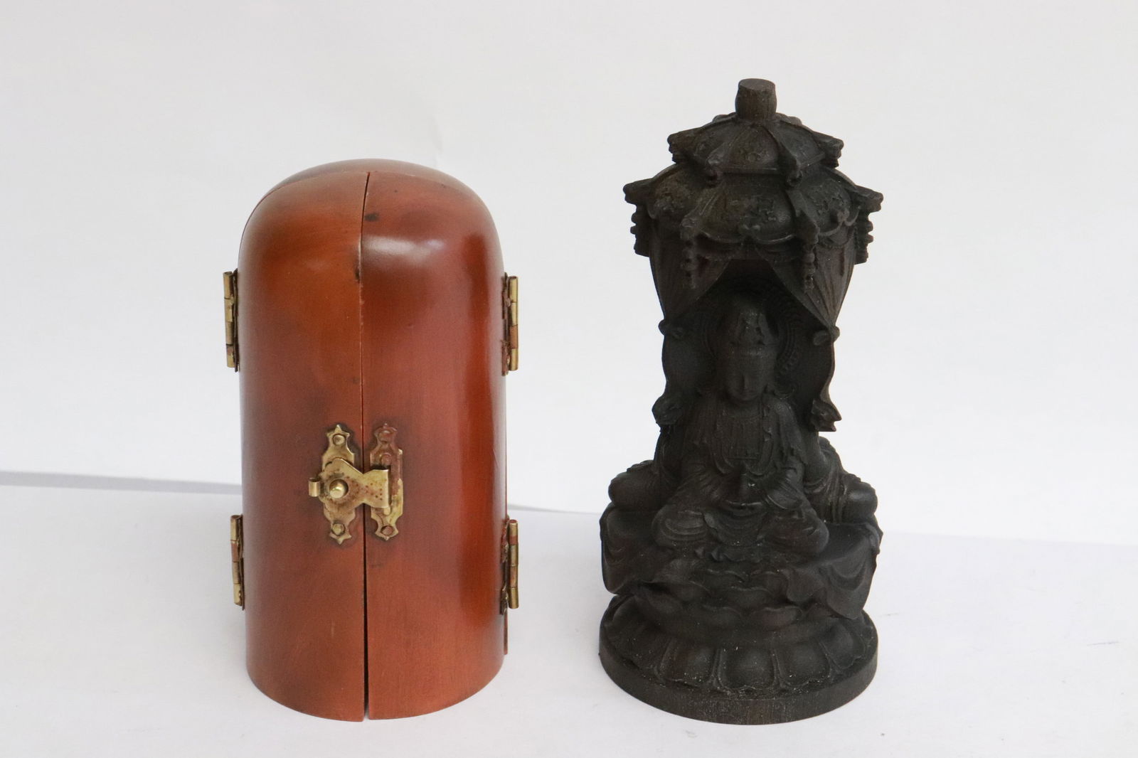 2 wood like carvings to depict deities (1 of 10)