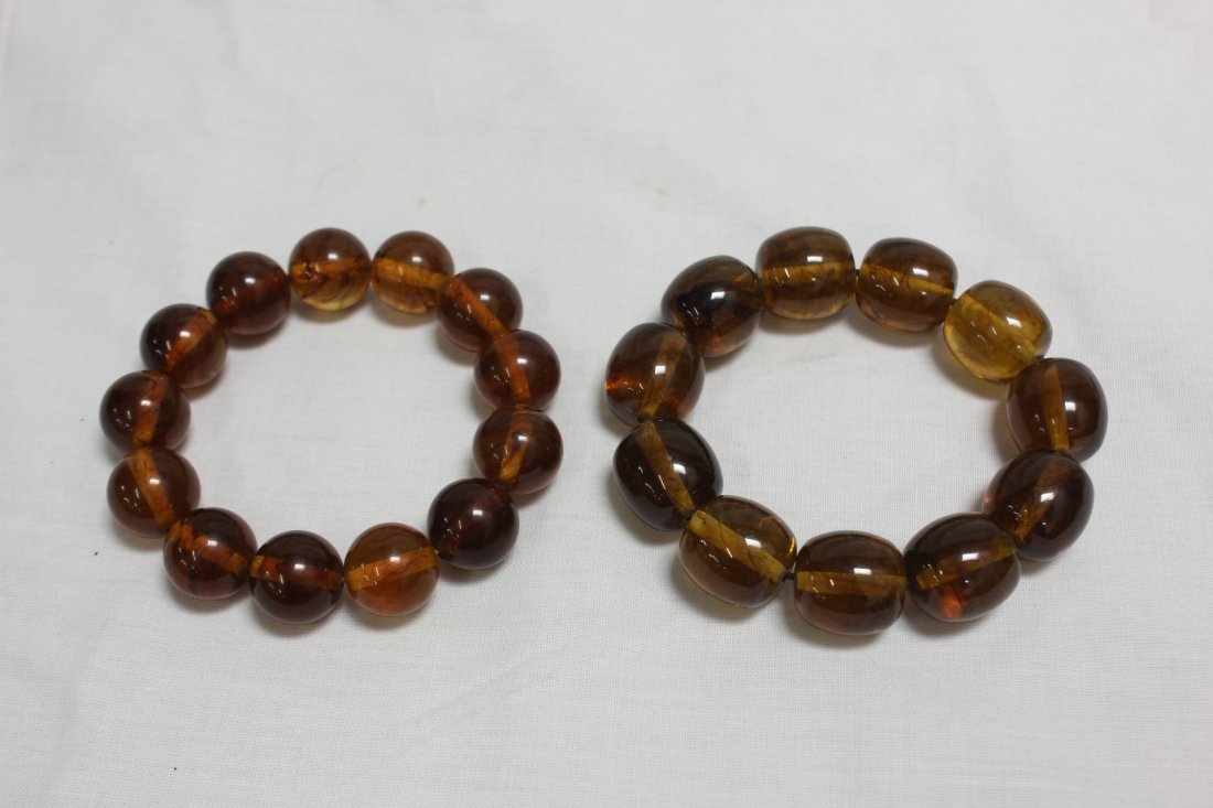 2 amber bracelets: 2 amber bracelets (0.8"L each, 11 beads) (12.55mm dia, 13 beads)