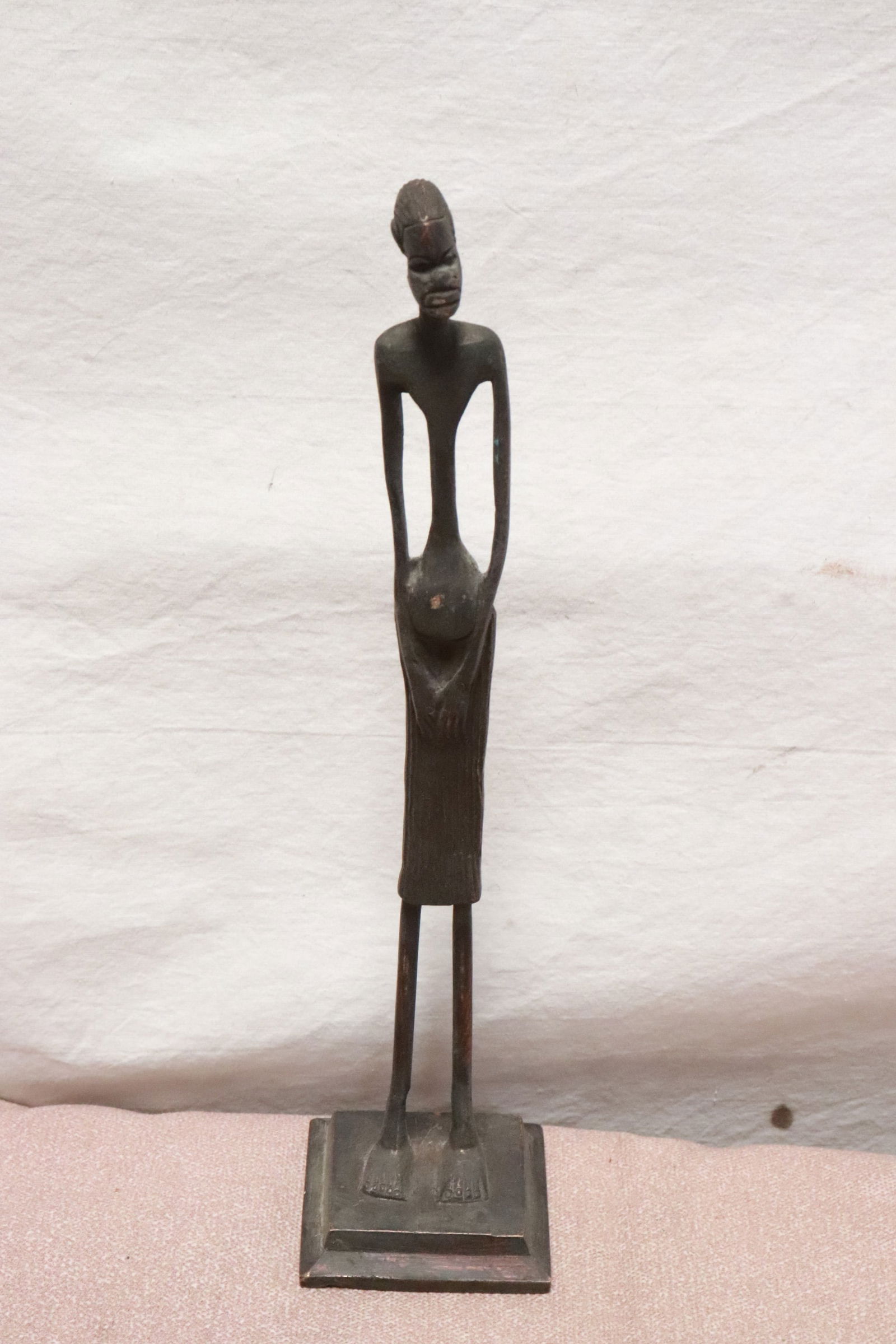 Bronze sculpture of African tall man: Bronze sculpture of African tall man, not signed, 11.7"H