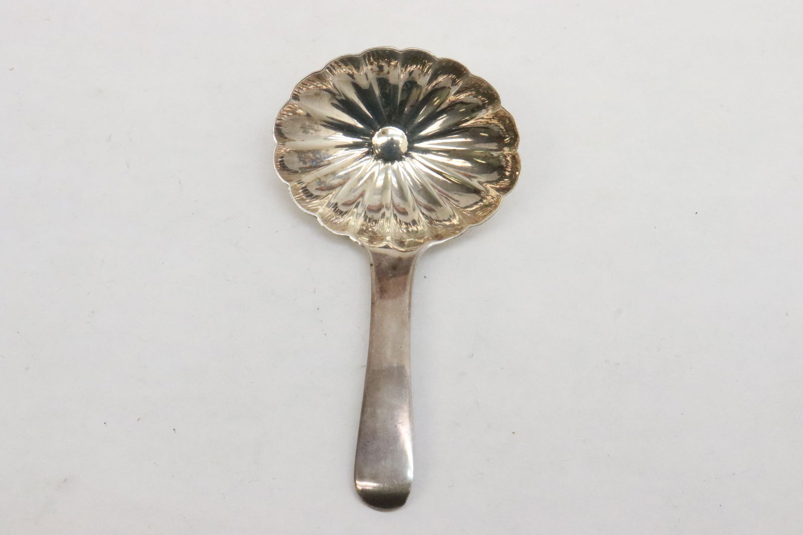 A Georgian sterling candy spoon: A Georgian sterling candy spoon, wt. 7.8gm, 3.1"L