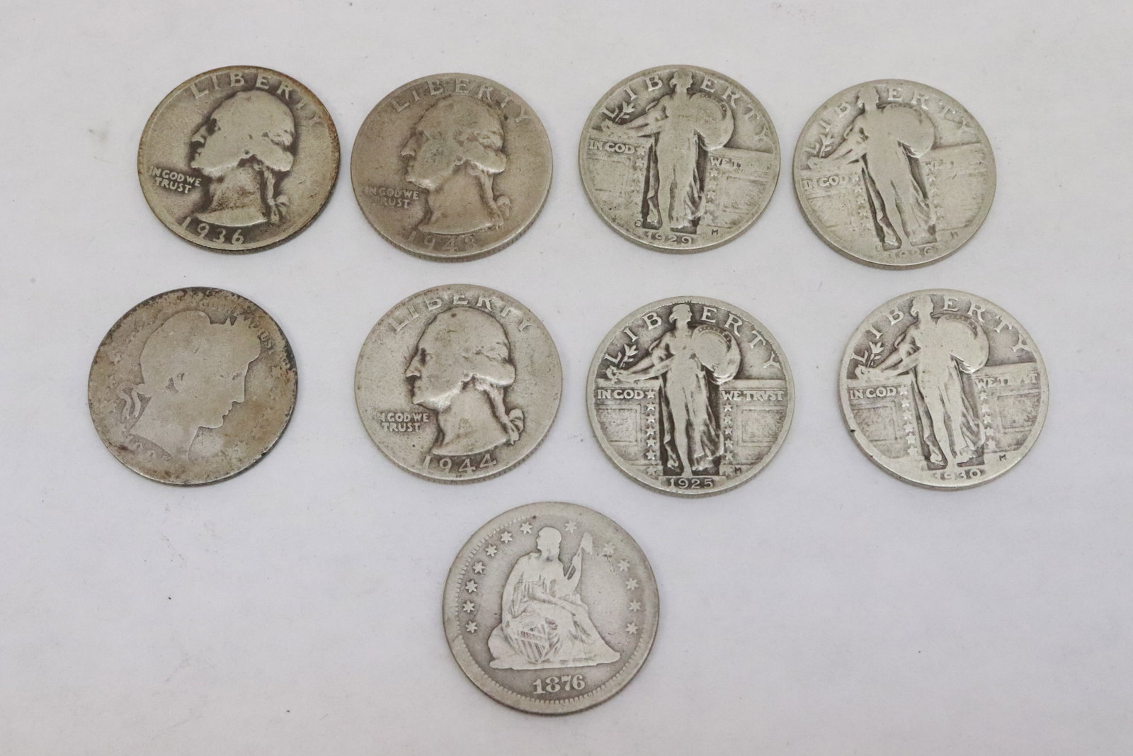 9 US silver quarters, various dates: 9 US silver quarters, various dates