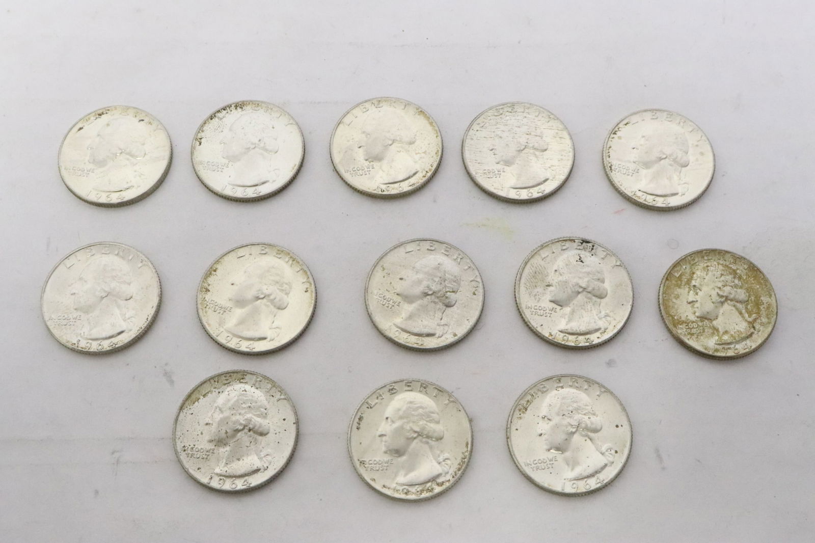 13 uncirculated 1964 US silver quarters: 13 uncirculated 1964 US silver quarters