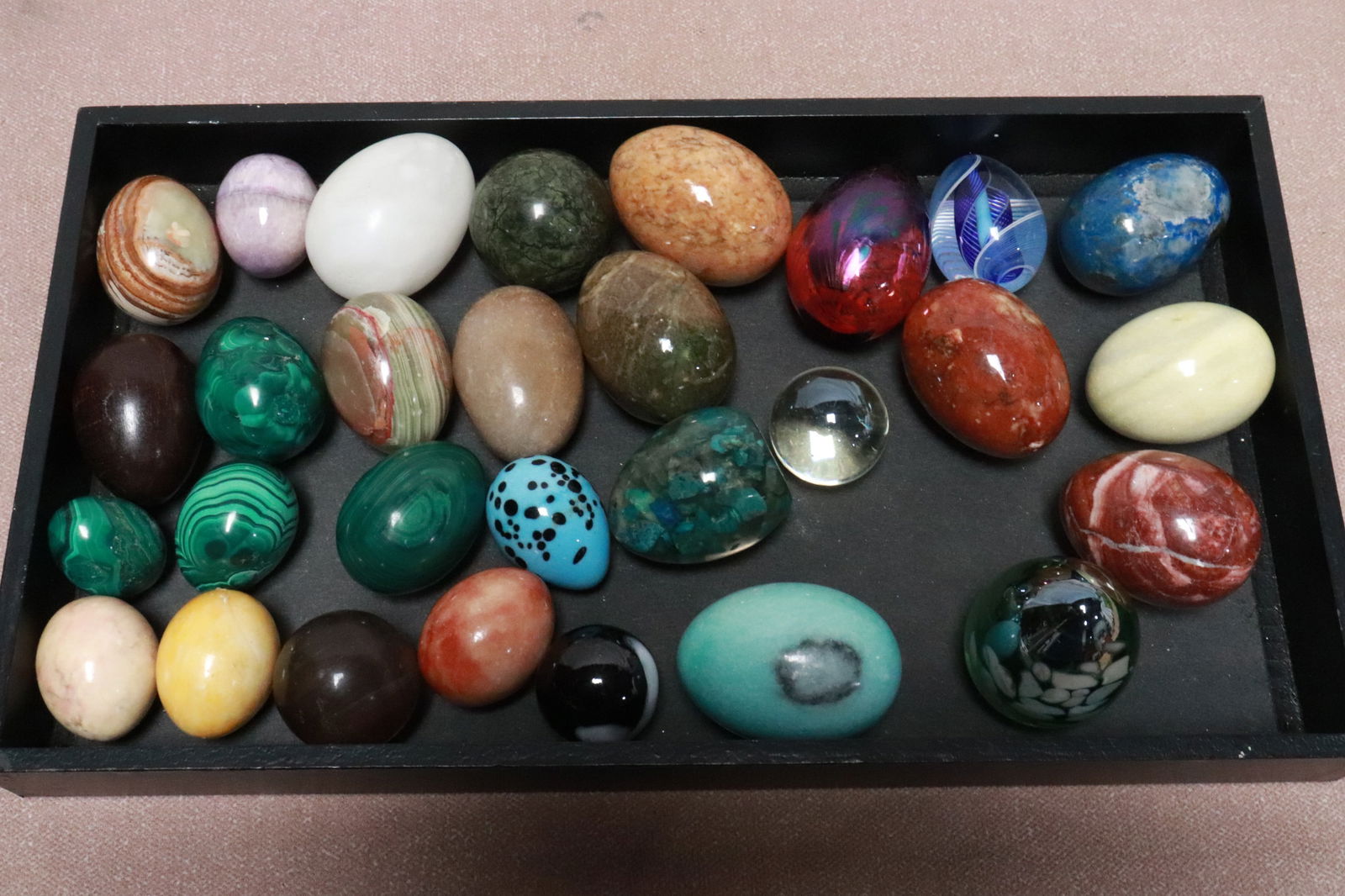 Large lot of stone carved, and art glass eggs: Large lot of stone carved, and art glass eggs; including malachite, lapis, etc., 1.7"x1.35"dia - 2.7"x1.8"dia