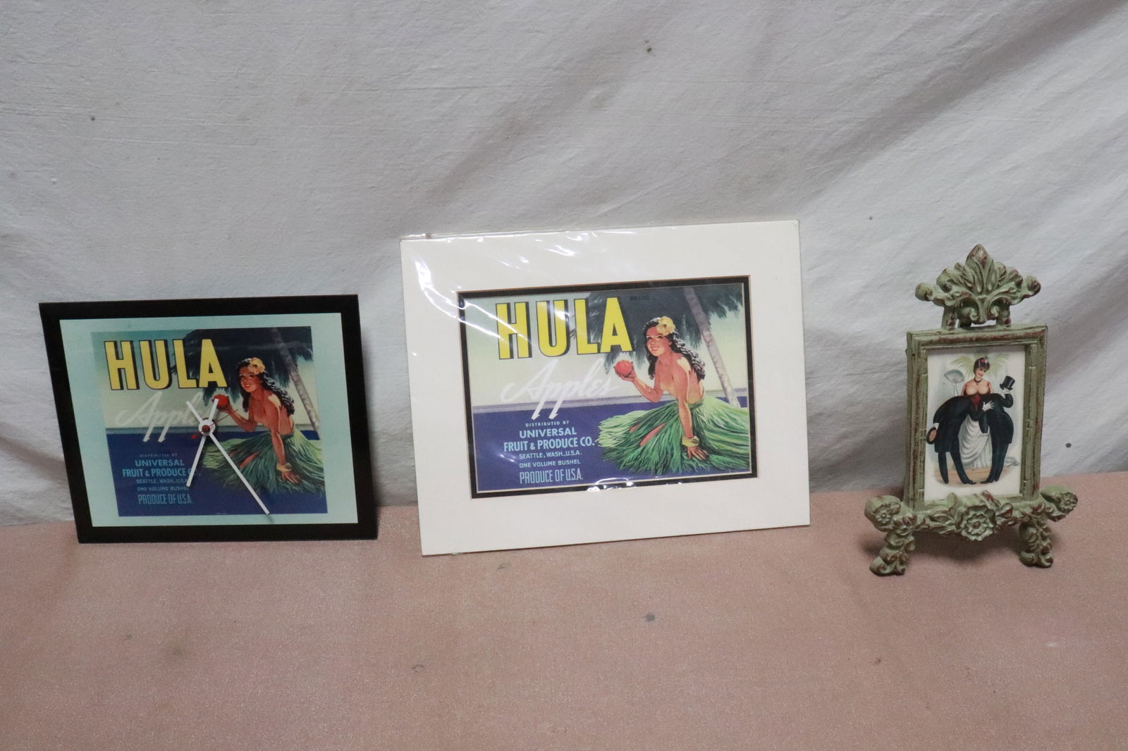 2 Hawaiian motif wall hanging, & a cast iron picture frame: 3 pieces; 2 Hawaiian motif wall hanging (11.4"x7.3"x5", 11"x14"x0.15"), and a cast iron picture frame (9"x11"x1.5")