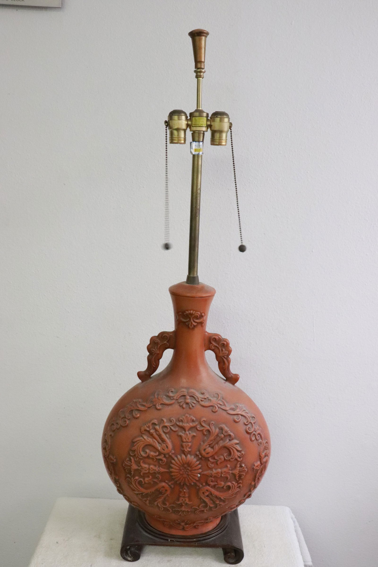 An earthenware jar made as a lamp: An earthenware jar (21.5"x14.6"x7.85") made as a lamp (42.5"H)