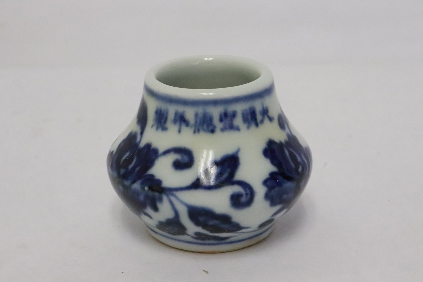 A blue and white porcelain bird feeder: A blue and white porcelain bird feeder, 1.7"x2.3"x2.1"