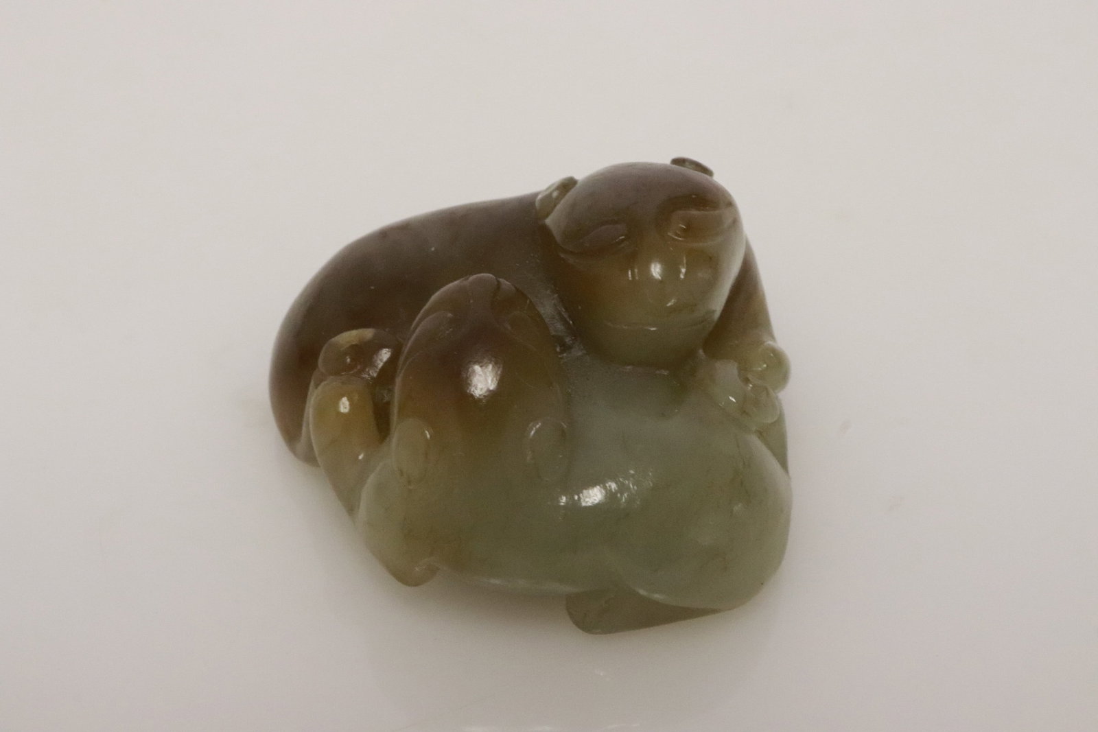 Celadon jade carved qilin group: Celadon jade carved qilin group, 1.15"x1.7"x1.65"