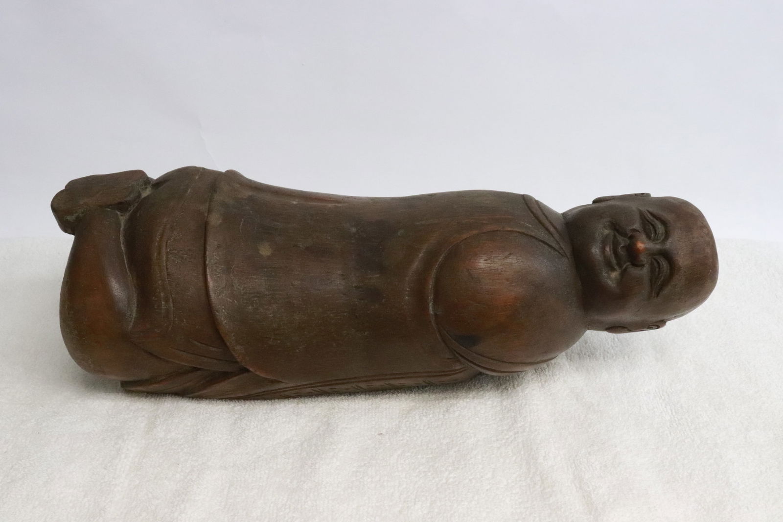 Wood carved pillow in the form of monk: Wood carved pillow in the form of monk, 4.25"x13.5"x5.6"