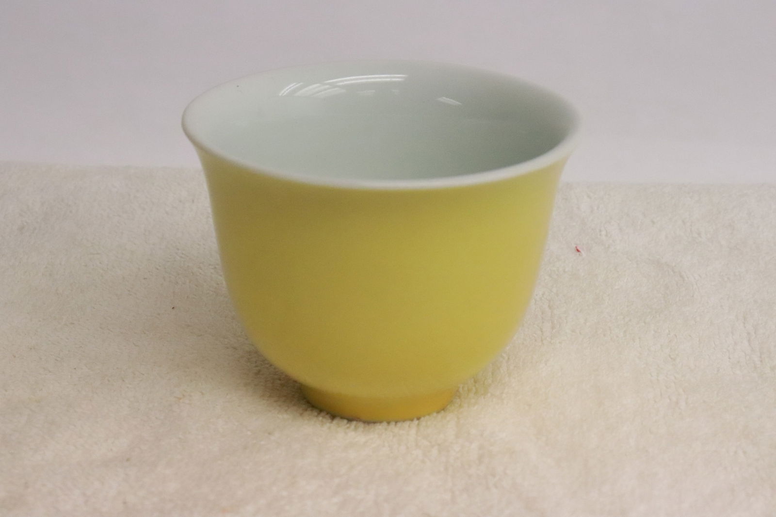 Yellow glazed porcelain tea bowl: Yellow glazed porcelain tea bowl, 2.7"x3.4"dia