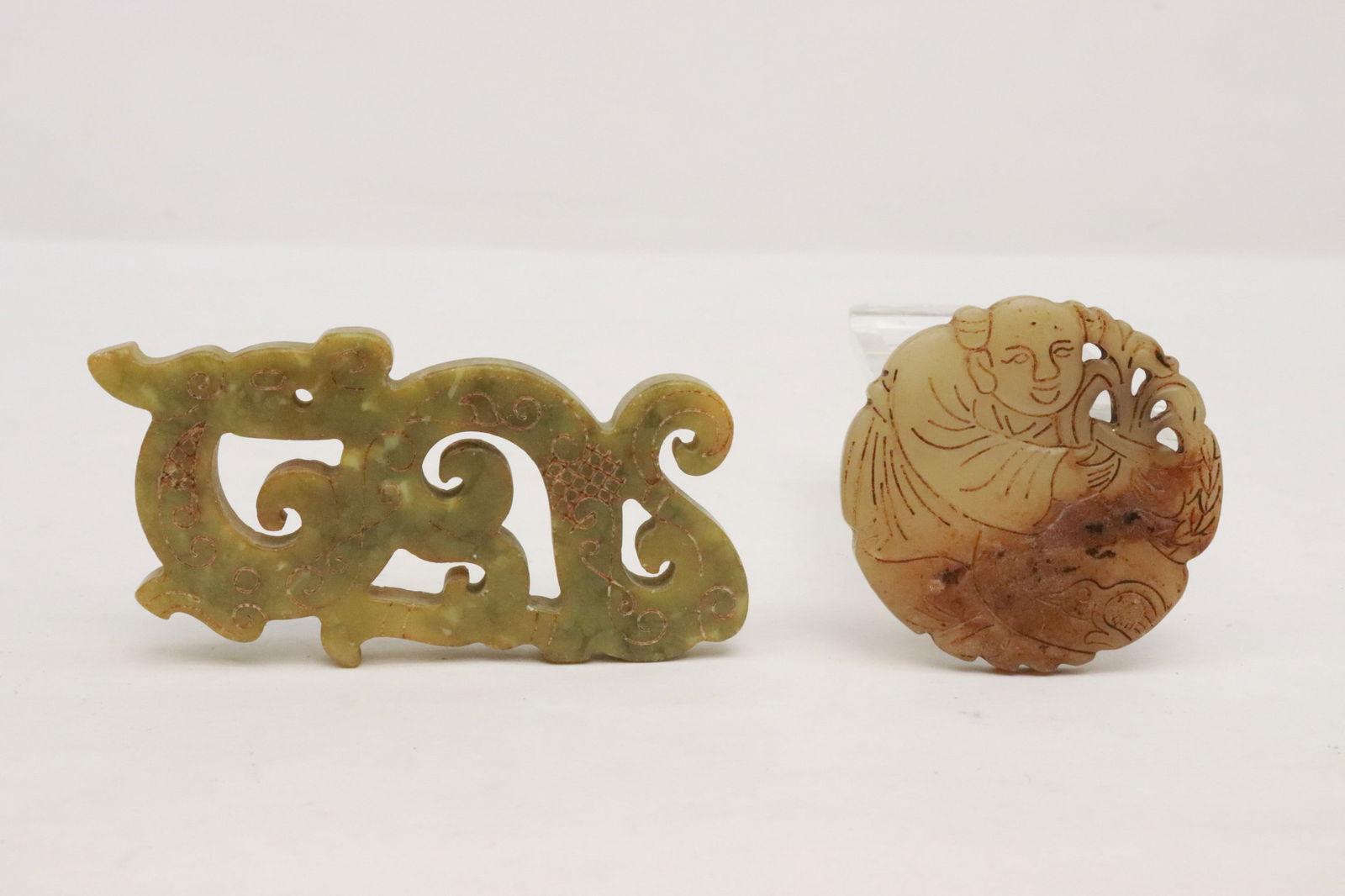 2 jade like stone carved ornaments: 2 jade like stone carved ornaments, 0.2"x2"dia, 1.75"x3.8"x0.33"