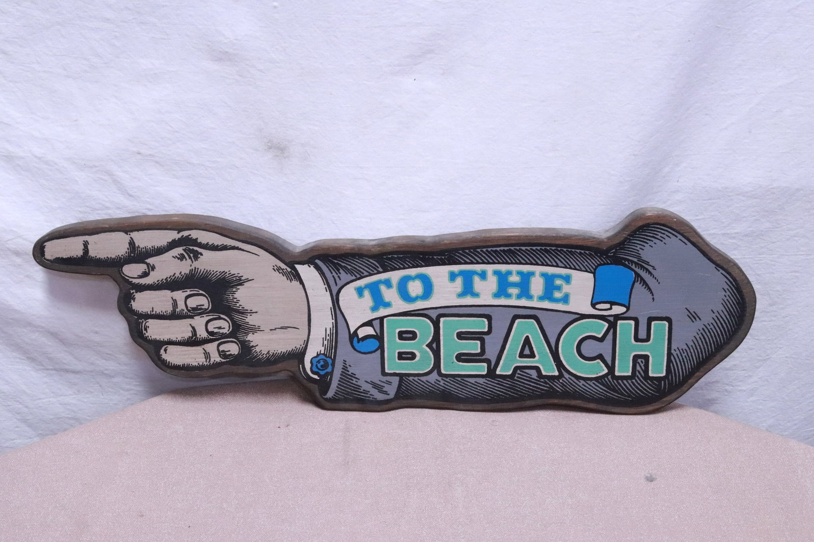 A carved and painted wood sign: A carved and painted wood sign, 24.15"x7.2"x0.83"