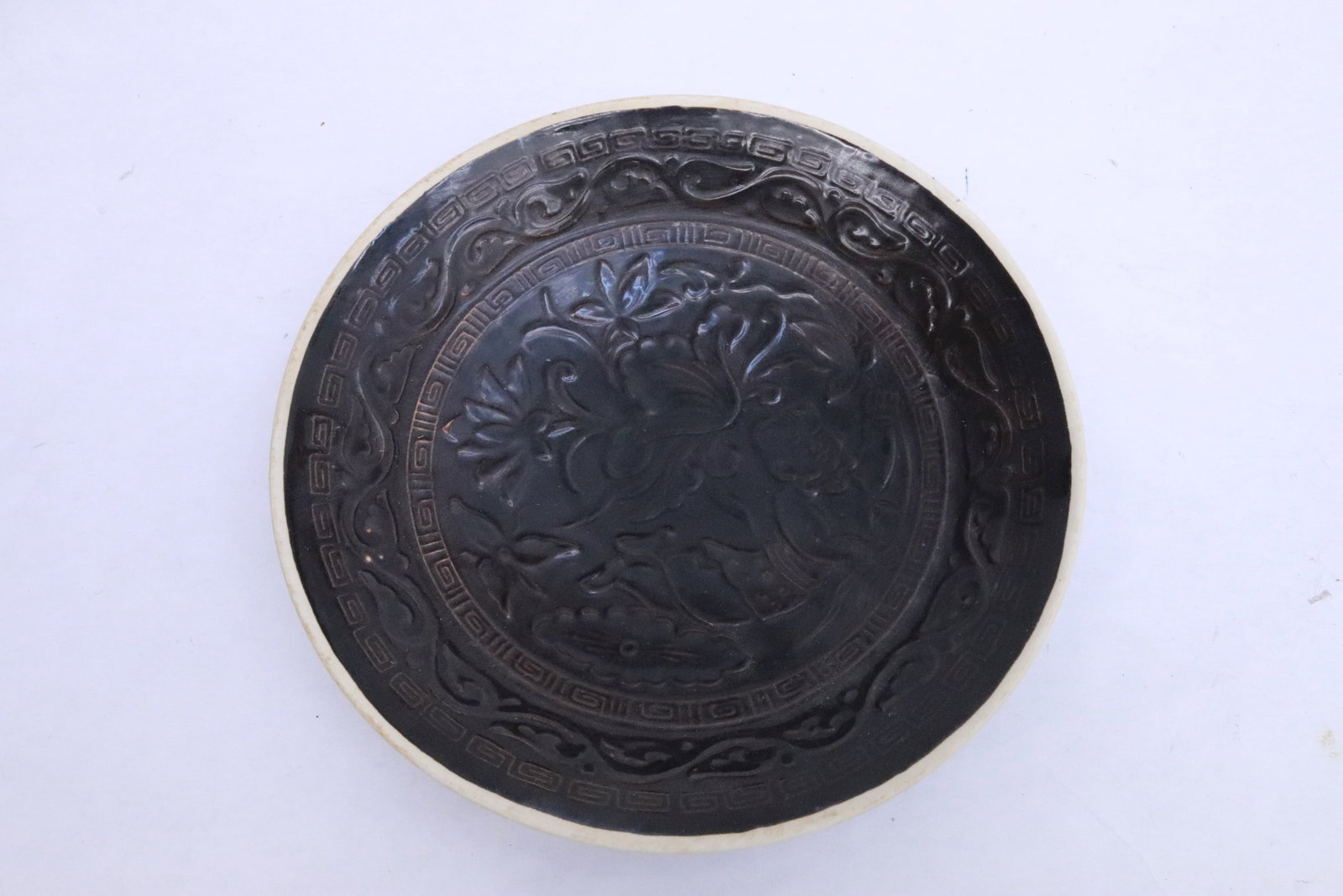 Brown porcelain bowl with embossed decoration: Brown porcelain bowl with embossed decoration, 1.6"x8"dia