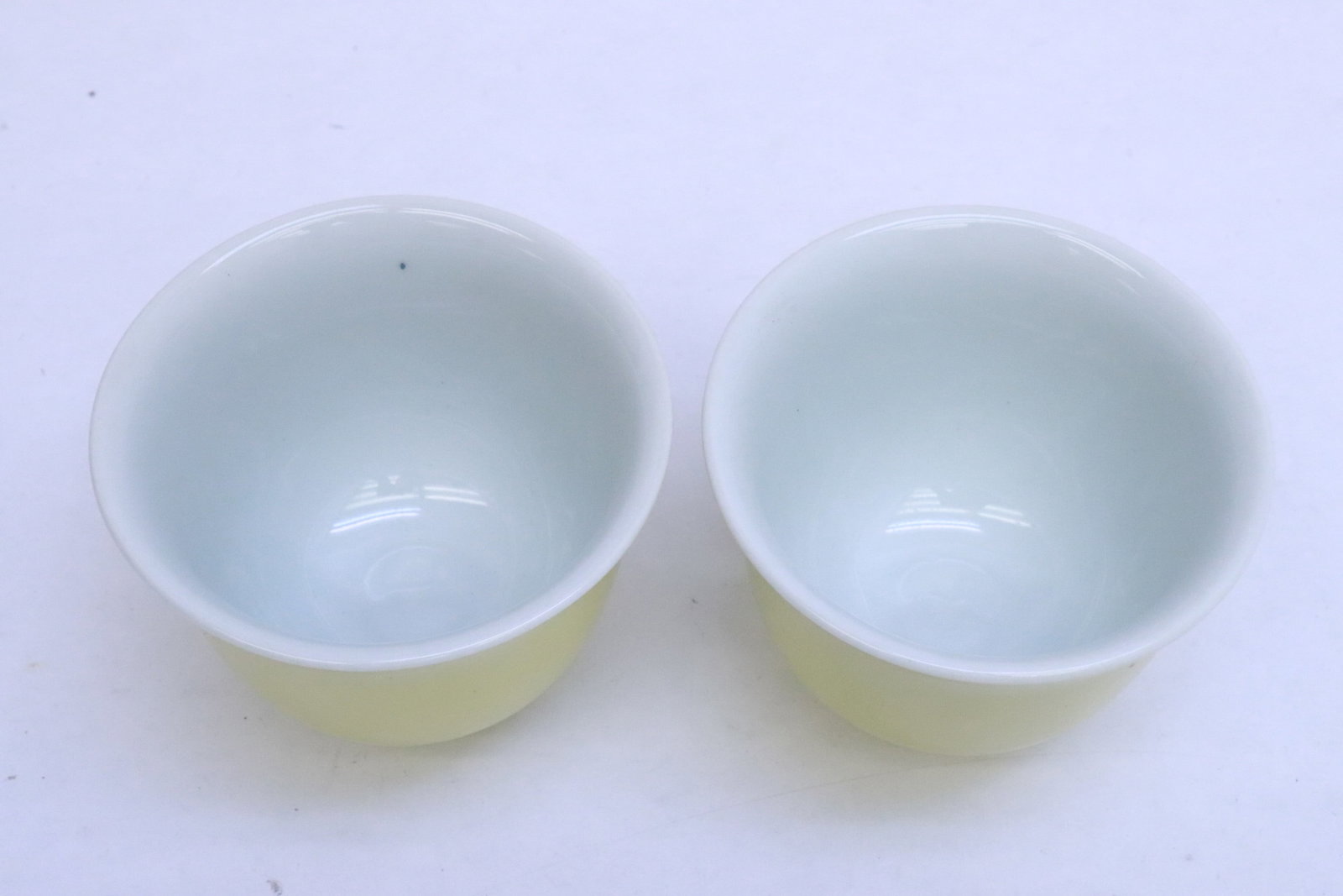 2 yellow glazed tea cups - 2