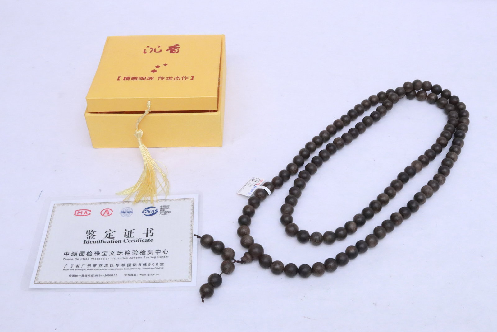 Agarwood bead necklace in box: Agarwood bead (0.38"x0.38"dia ea) necklace (44.6"L) in box (1.65"x4.68"x4.68")
