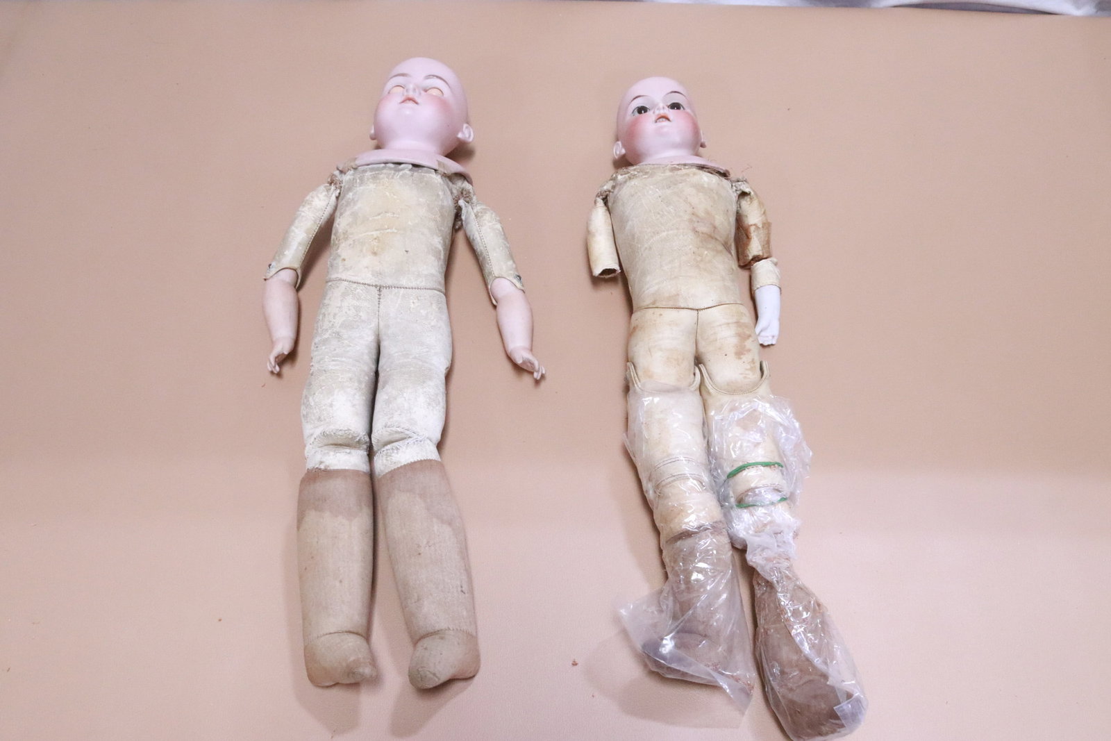 2 antique German bisque head dolls: 2 antique German bisque head dolls (18.2"H, 20.2"H), Floradora need repair