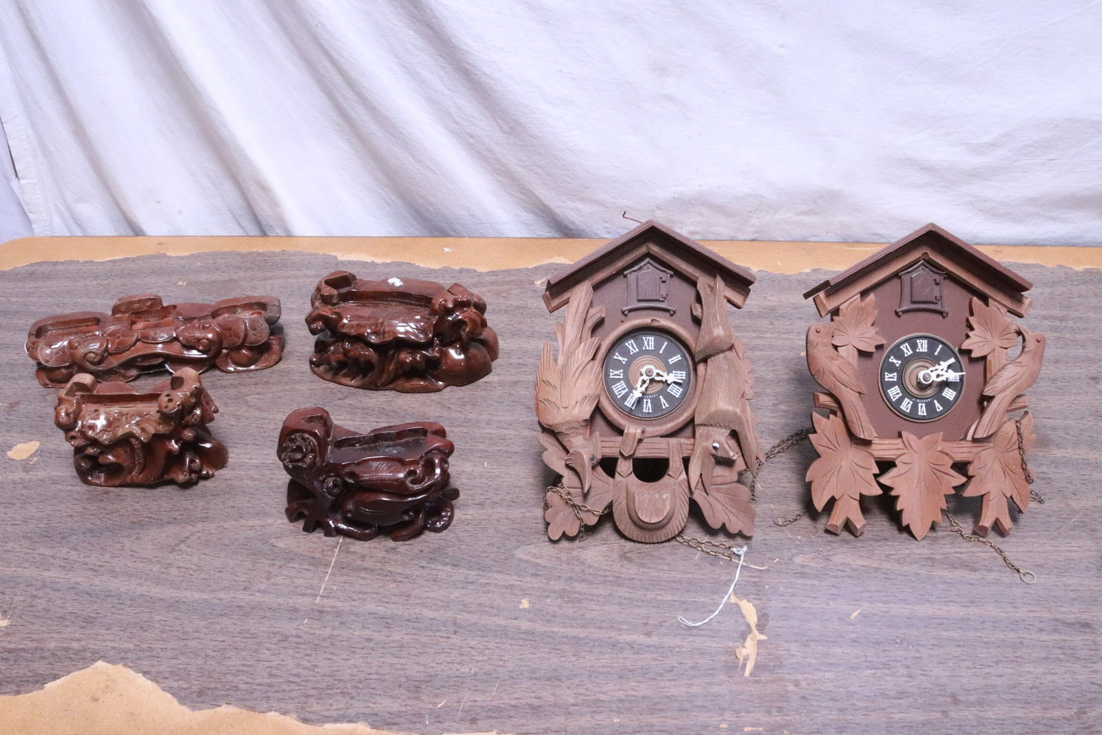 2 cuckoo clocks, and lot of Chinese stands: 2 cuckoo clocks (11.15"x8.4"x5", 11.2"x7.85"x5"), and lot of Chinese stands (3.7"x6.2"x3.35" - 2.65"x10.7"x3.15")