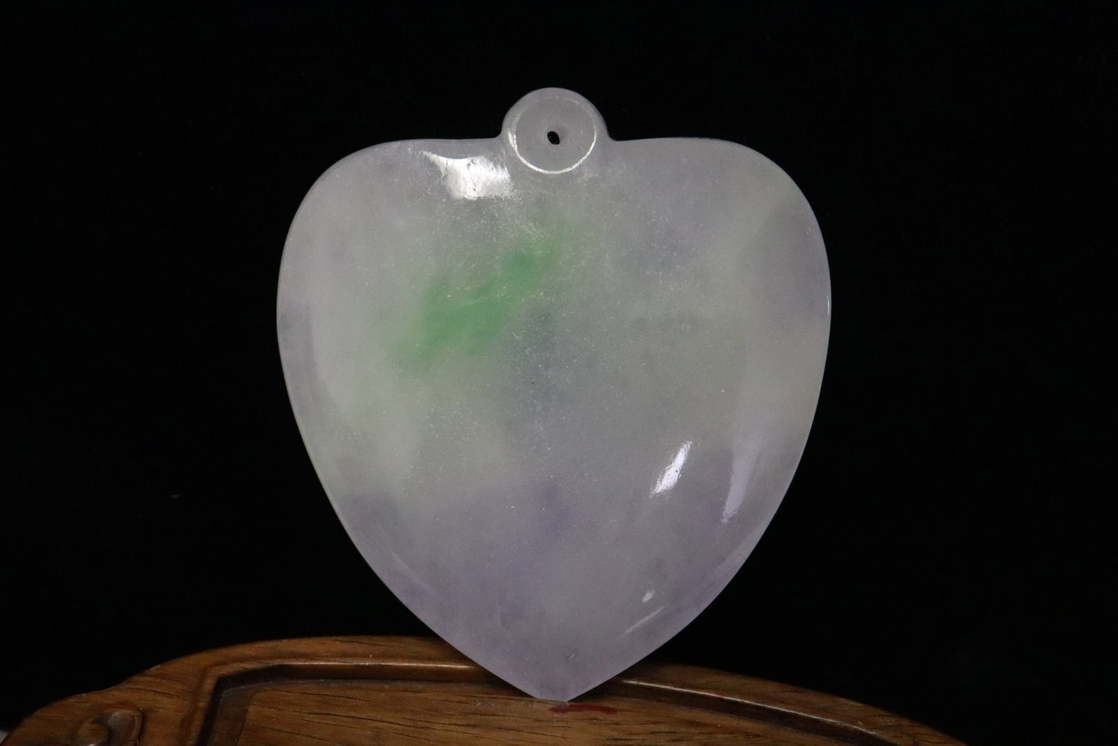 A jadeite carved pendant in heart motif: A jadeite carved pendant in heart motif, 2.25"x2.05"x0.33" (box:3.2"x2.7"x1.25")