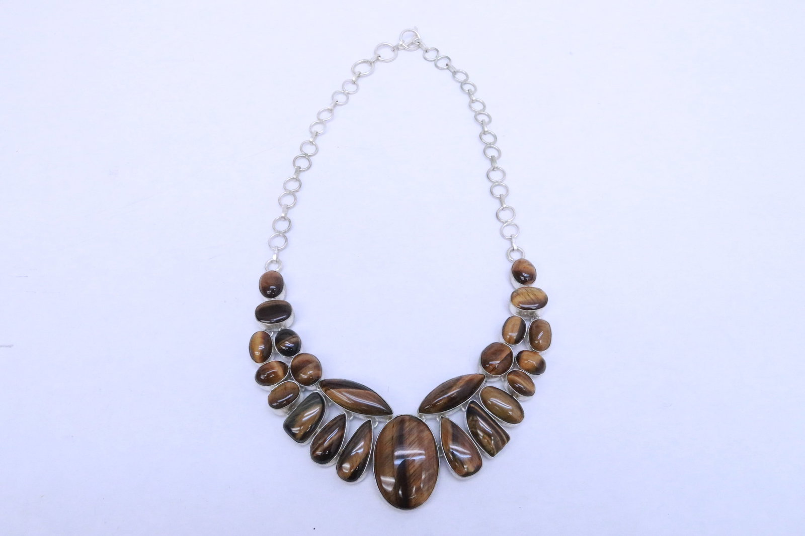 Large sterling necklace with tiger eye stones: Large sterling necklace with tiger eye stones, wt. 110gm, 21"L