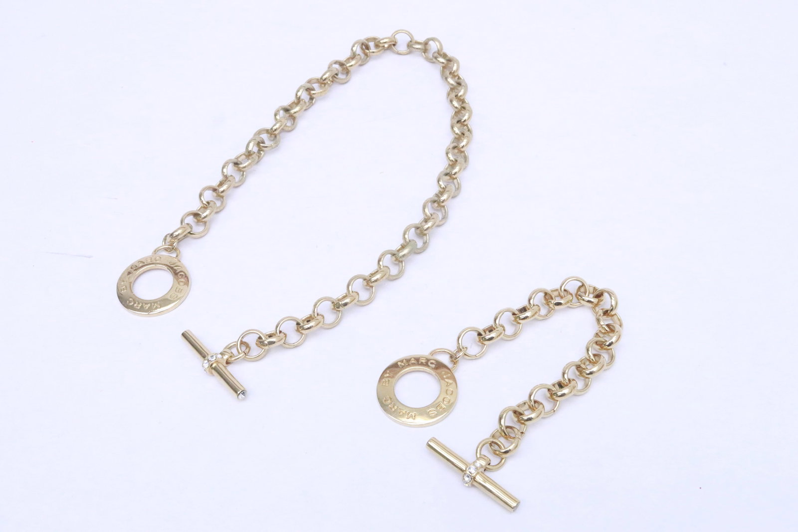 2 Marc Jacobs gold tone keychains: 2 Marc Jacobs gold tone keychains, 8.8"L, 18.5"L