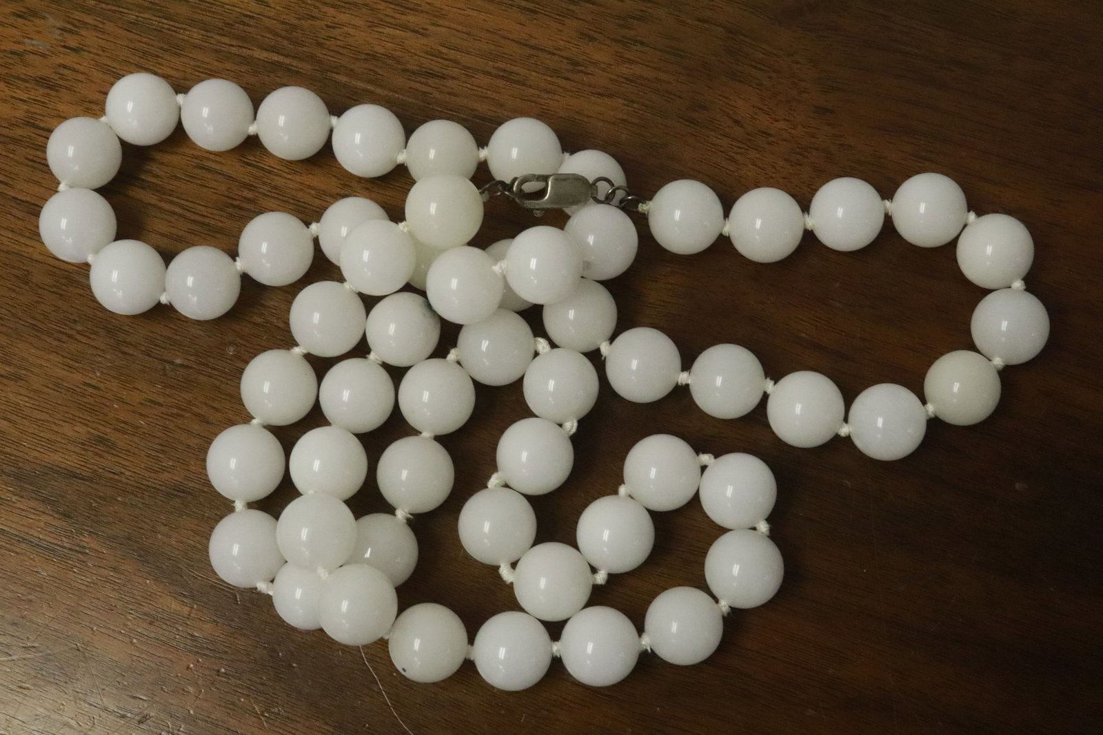 extra long jadeite bead necklace w/ sterling clasp: A rare extra long large natural white jadeite bead necklace, bead measures approx. 14mm diameter with sterling clasp