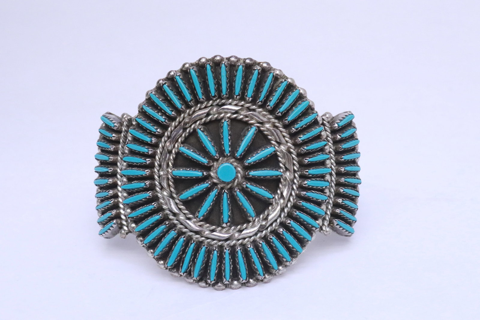 A fancy sterling and turquoise bangle: A fancy sterling and turquoise bangle, wt. 41.2gm, 2"x2.65"x2.2"
