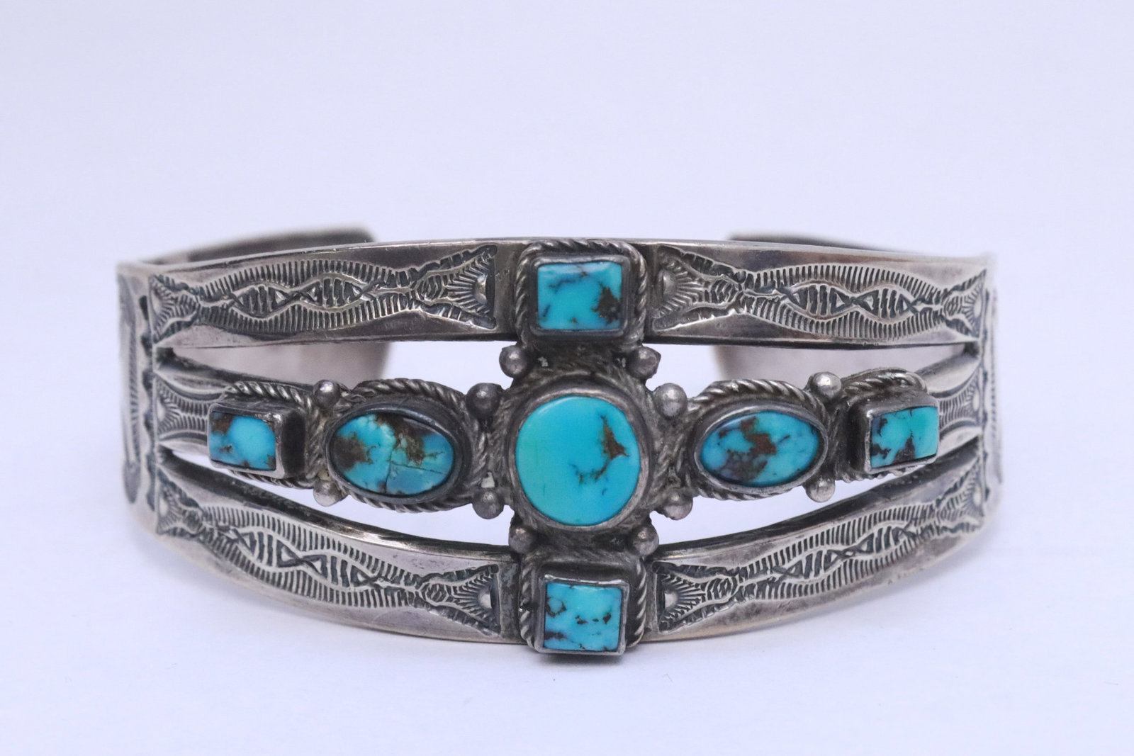 A sterling and turquoise bangle: A sterling and turquoise bangle, wt. 36.5gm, 1"x2.5"x2.1"