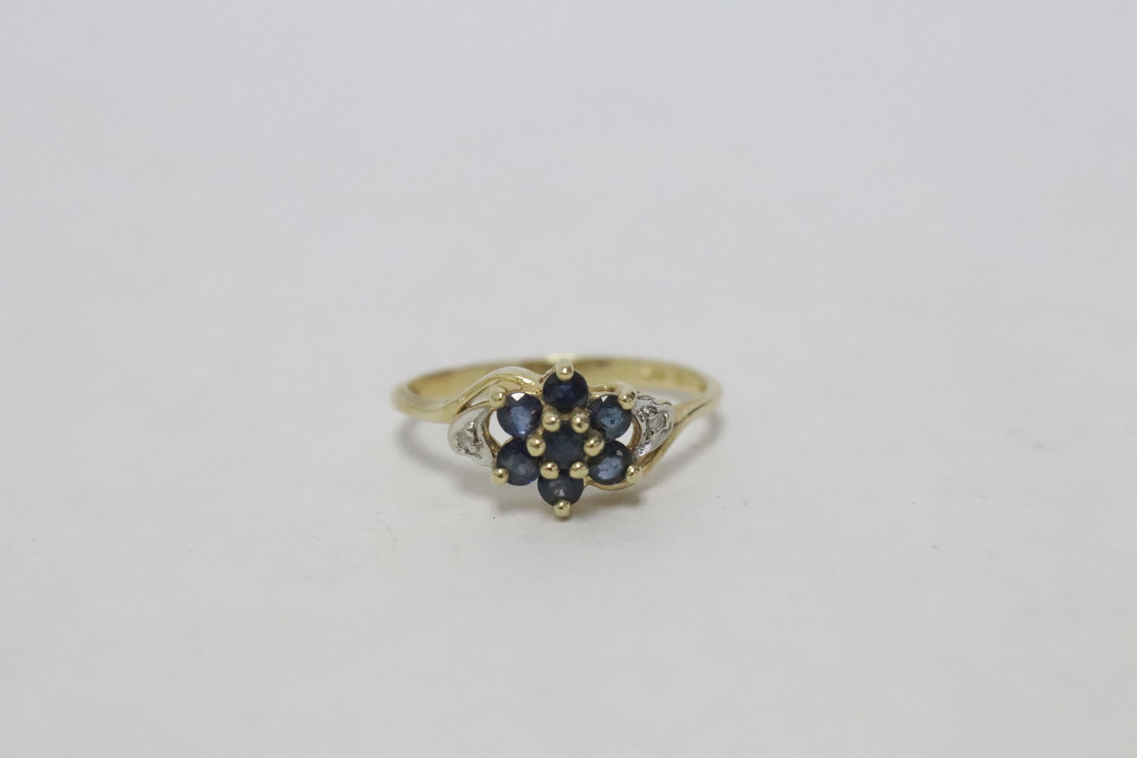 10K Y/G ring with sapphire & diamond: 10K Y/G ring with sapphire and small diamond, wt. 1.7gm, size 6.5