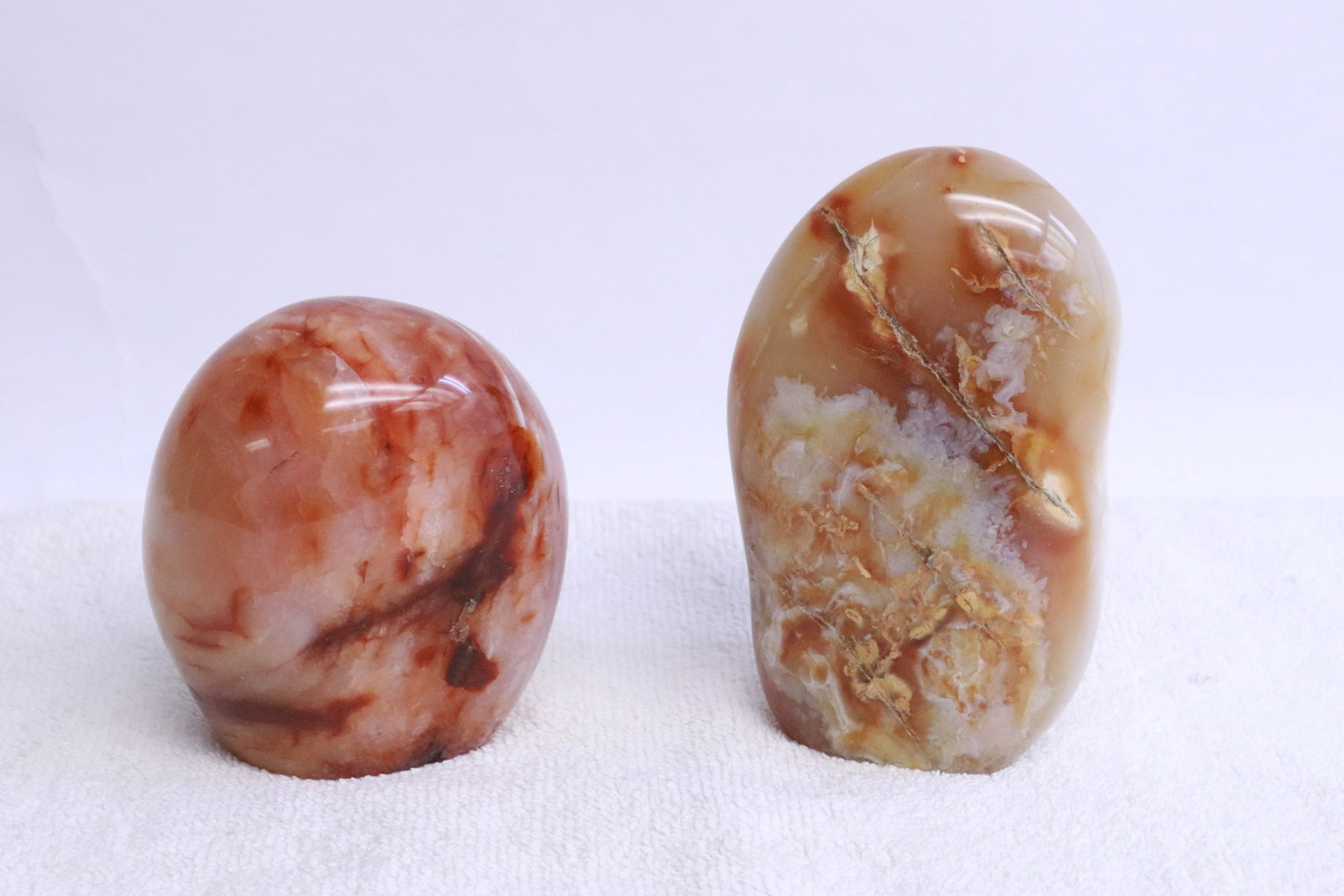 2 polished agate stones: 2 polished agate stones, 3.35"x2.2"x2.9", 4.3"x1.85"x2.7"