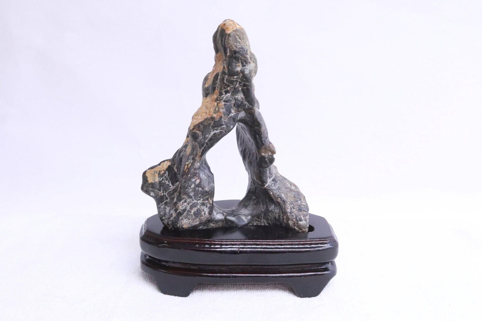 A scholar stone on stand: A scholar stone (7.75"H) on stand