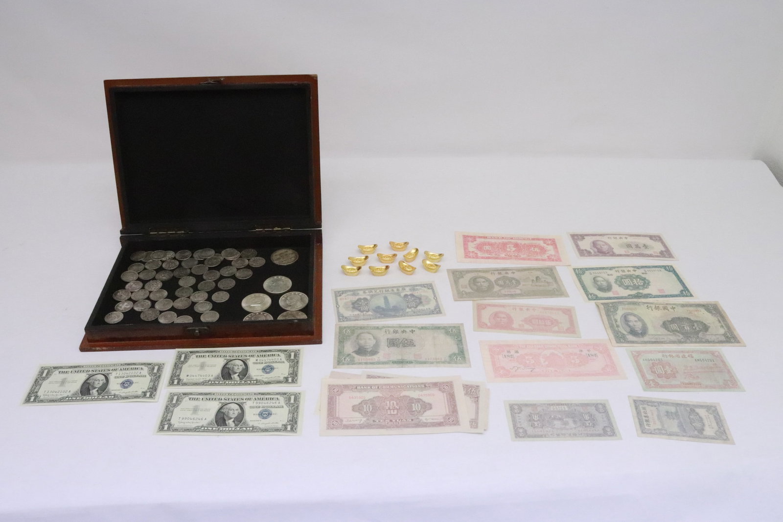 Box of coins, a currency, and nuggets: Box (1.9"x11.65"x8.65") of coins, a currency, and nuggets; Chinese coin and currency are fake, only for souvenir purpose, the gold like nuggets are NOT gold, only for decorative purpose