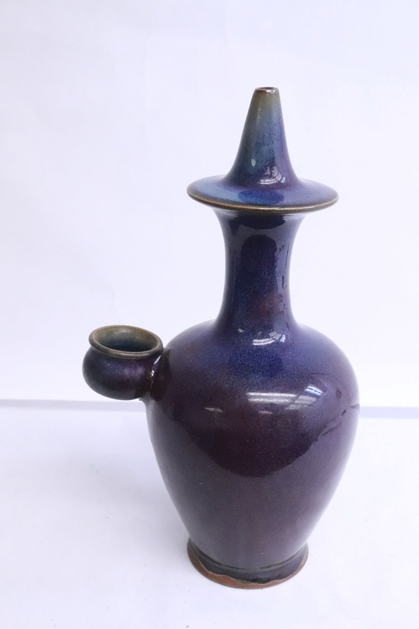 A blue/ purple glazed porcelain oil jar: A blue/ purple glazed porcelain oil jar, 10.2"x5.85"x4.5"