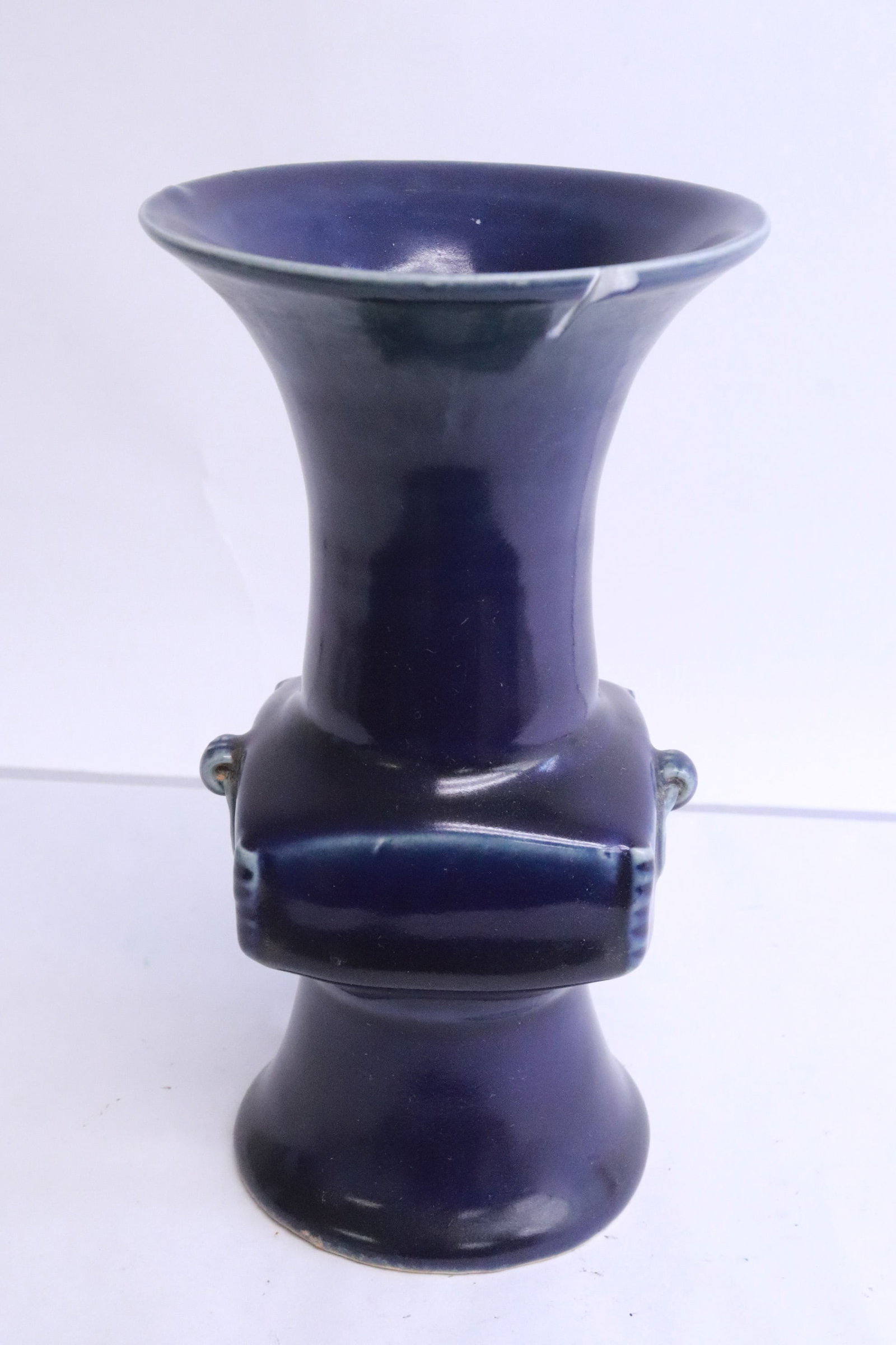 Blue glazed porcelain trumpet vase: Blue glazed porcelain trumpet vase, top edge chip, 7.2"x3.9"dia