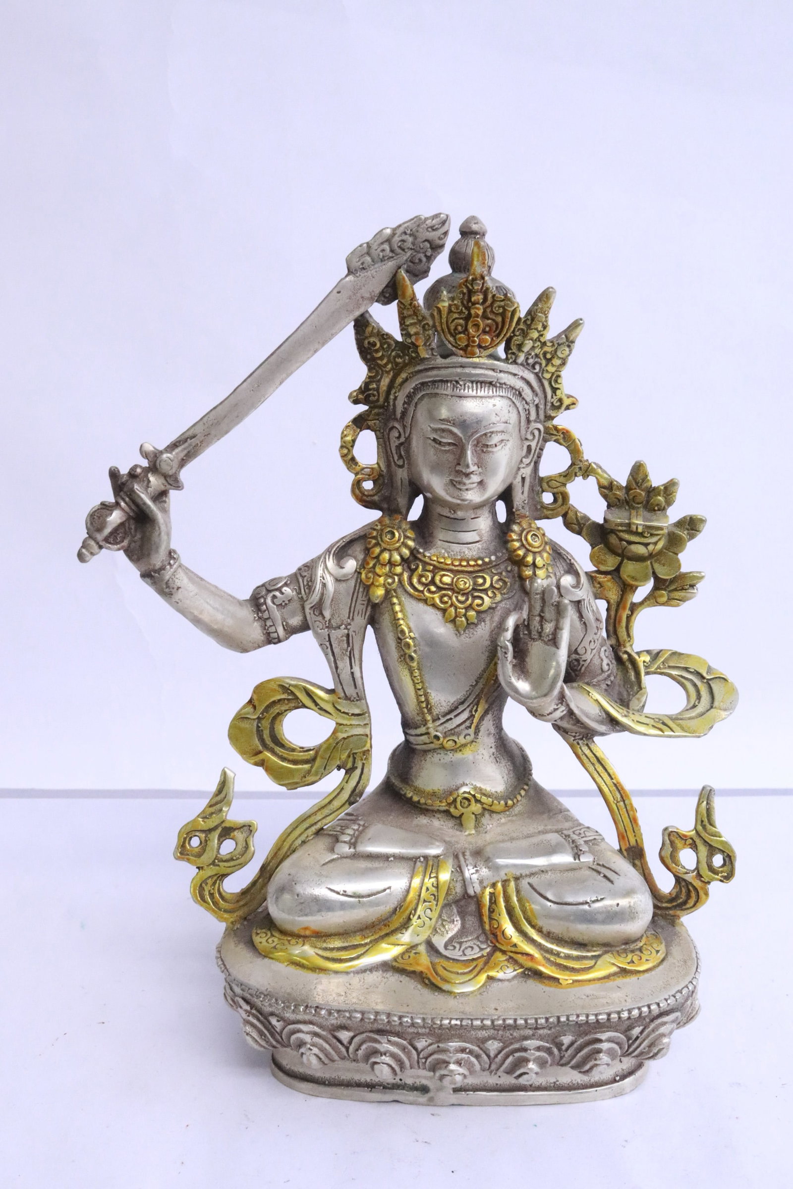 A white bronze sculpture of deity: A white bronze sculpture of deity, 8.4"H