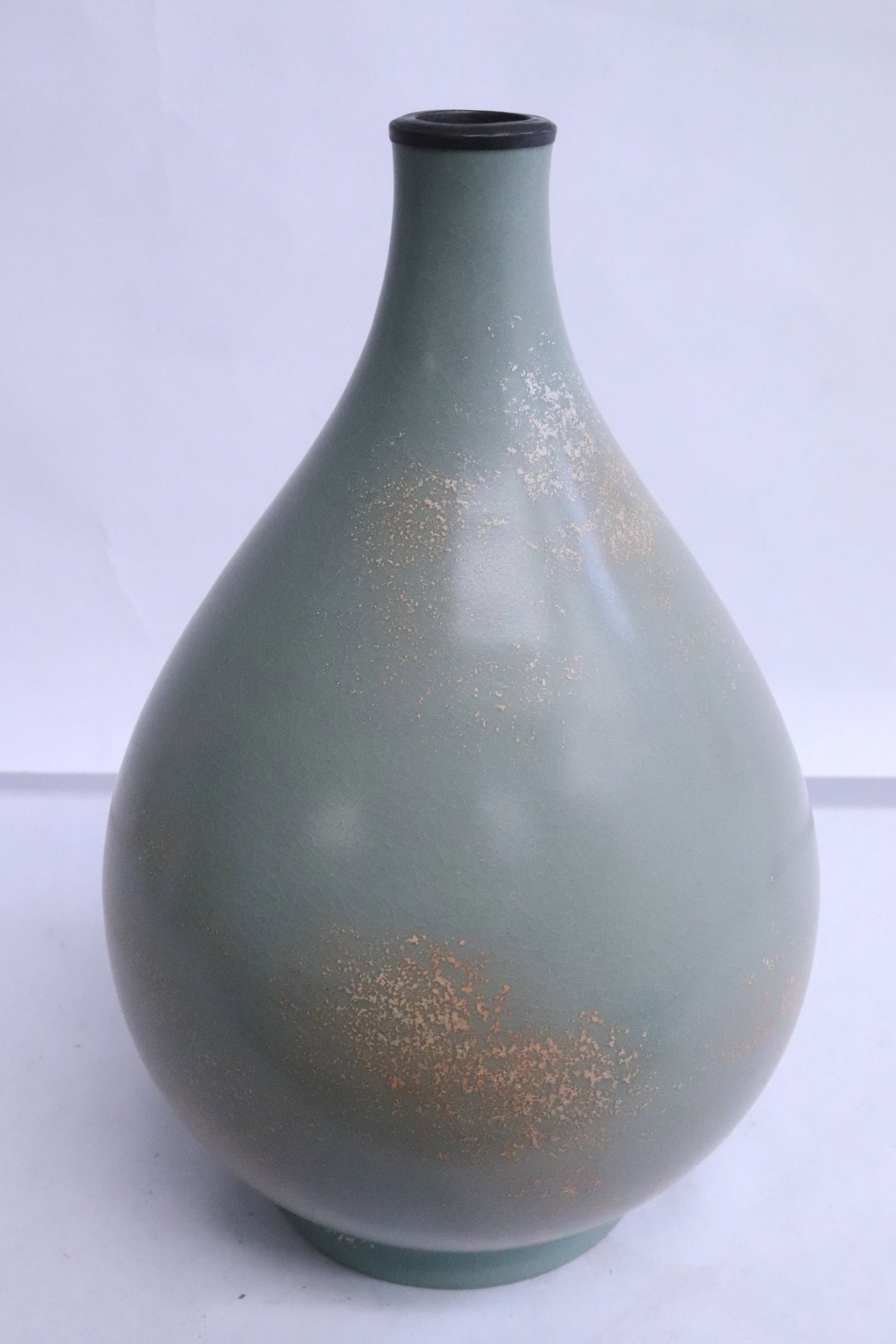 Very unusual gold speck on celadon bottle vase: Very unusual gold speck on celadon bottle vase, 9.8"x6.4"dia (box:7.9"x14.65"x9.6")