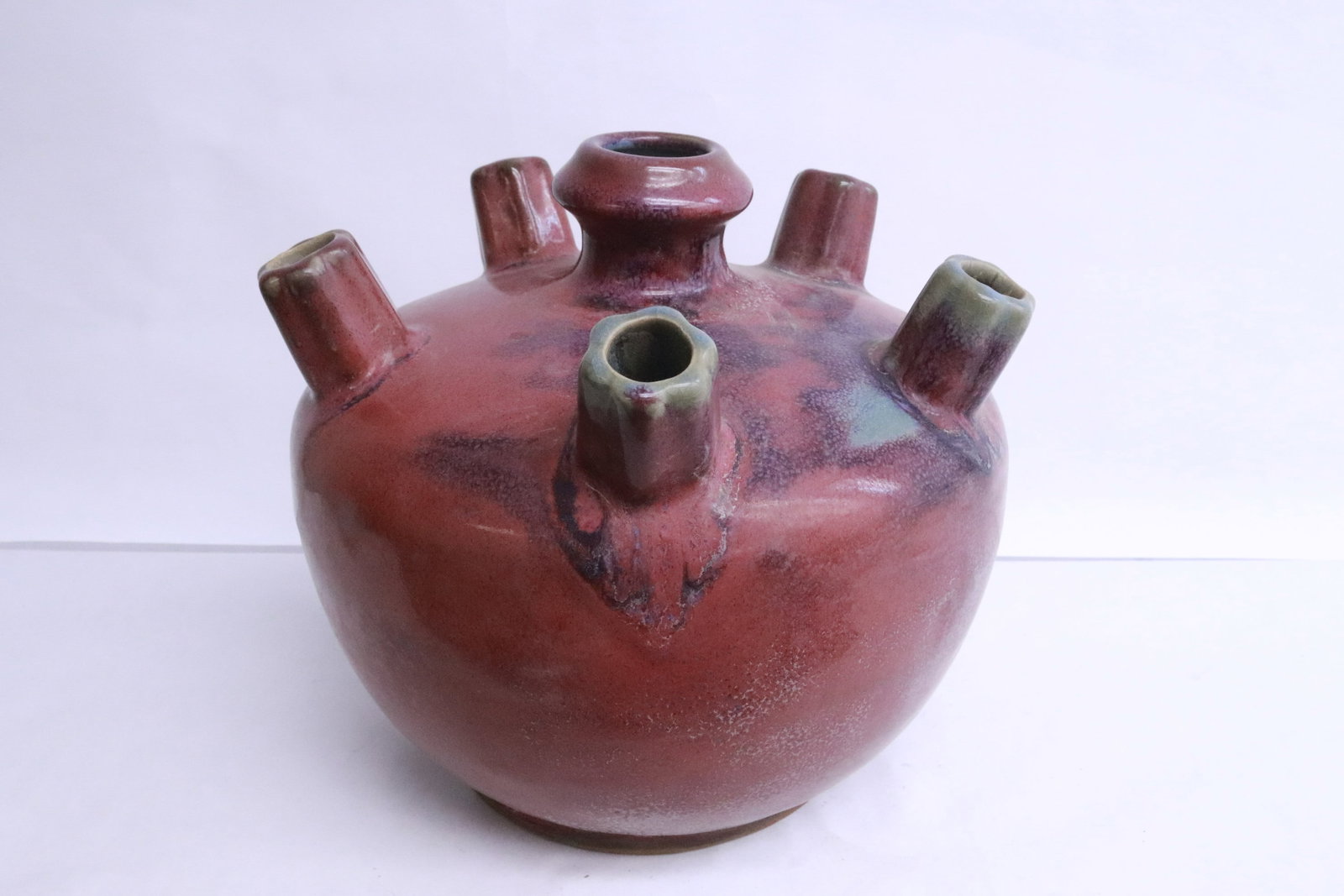 Unusual purple glazed 6-hole porcelain vase: Unusual purple glazed 6-hole porcelain vase, 8.75"x9.35"dia