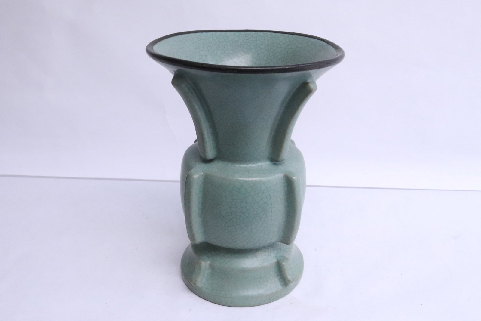 A celadon vase in the form of archaic bronze hu: A celadon vase in the form of archaic bronze hu, 7.85"x5.7"dia
