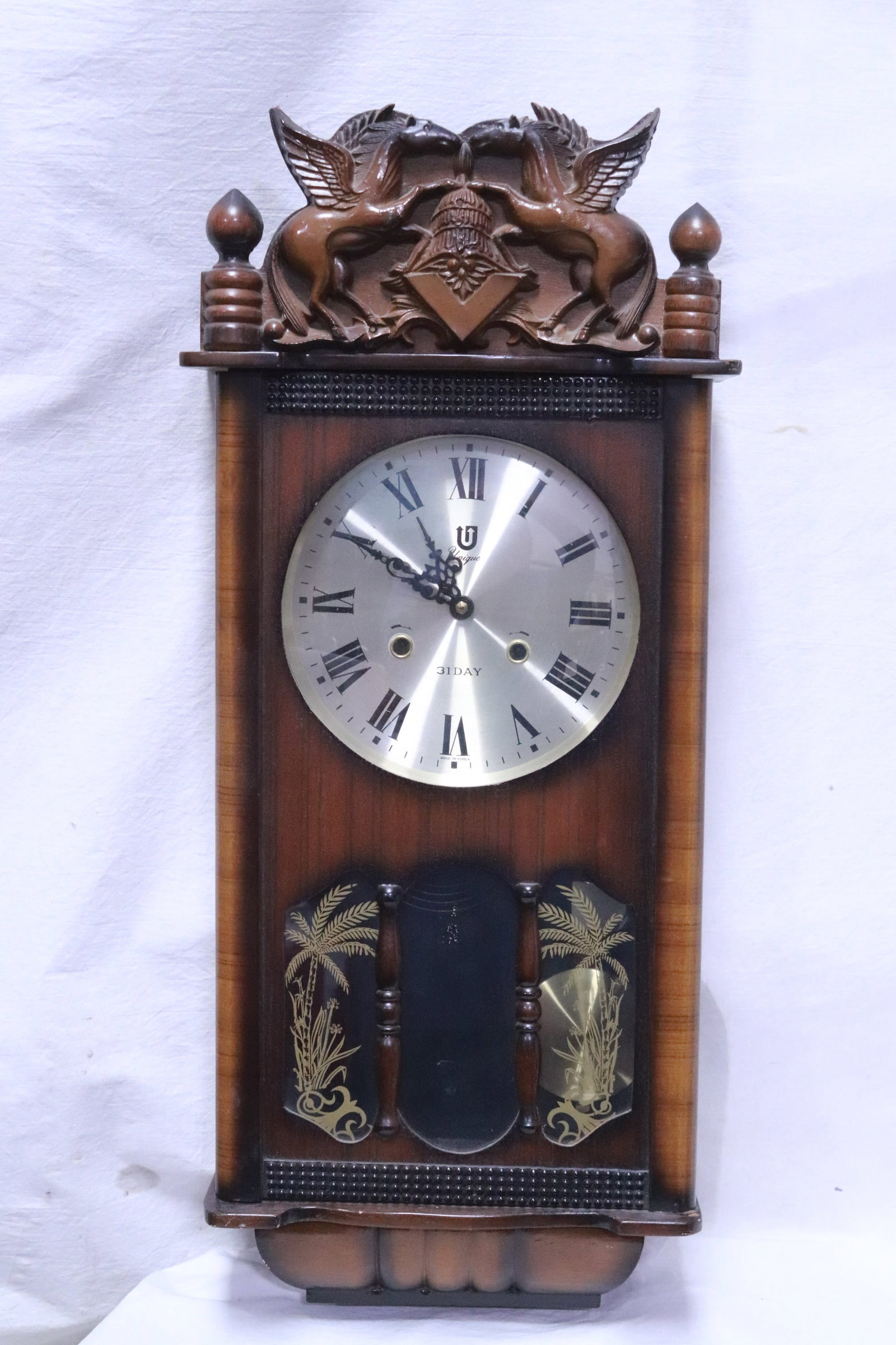 A 31-day key wind wall clock (1 of 6)