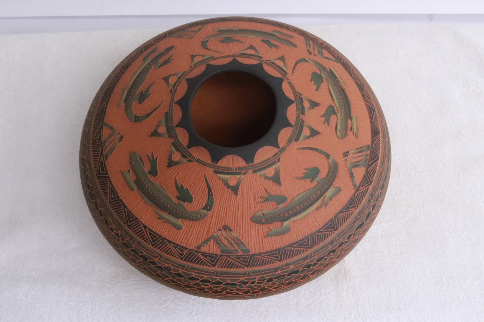 A Navajo etched pottery jar, signed: A Navajo etched pottery jar, signed, 4.6"x10.2"dia