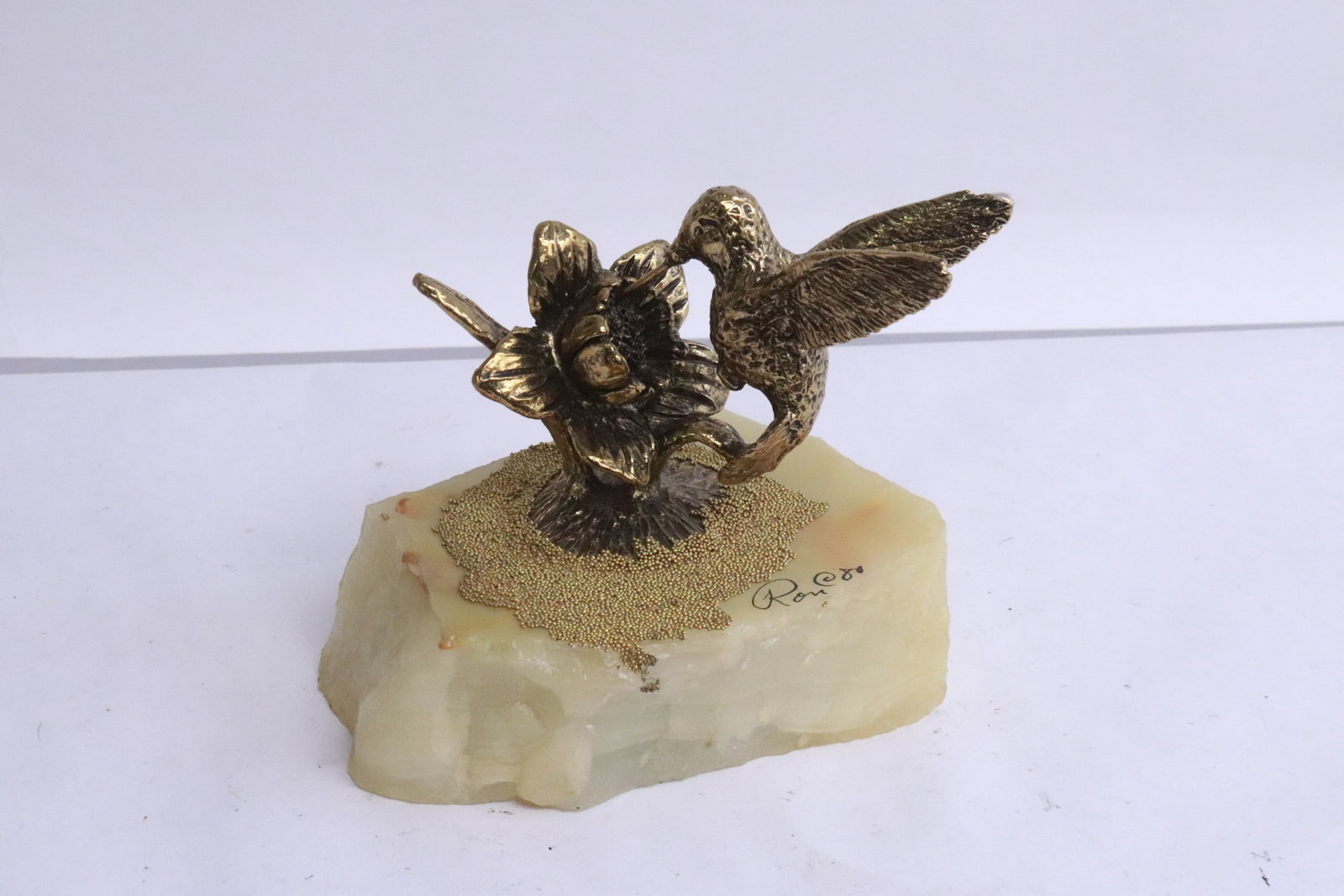 A Ron Lee sculpture of hummingbird on geo stone base: A Ron Lee sculpture of hummingbird on geo stone base, 4"H