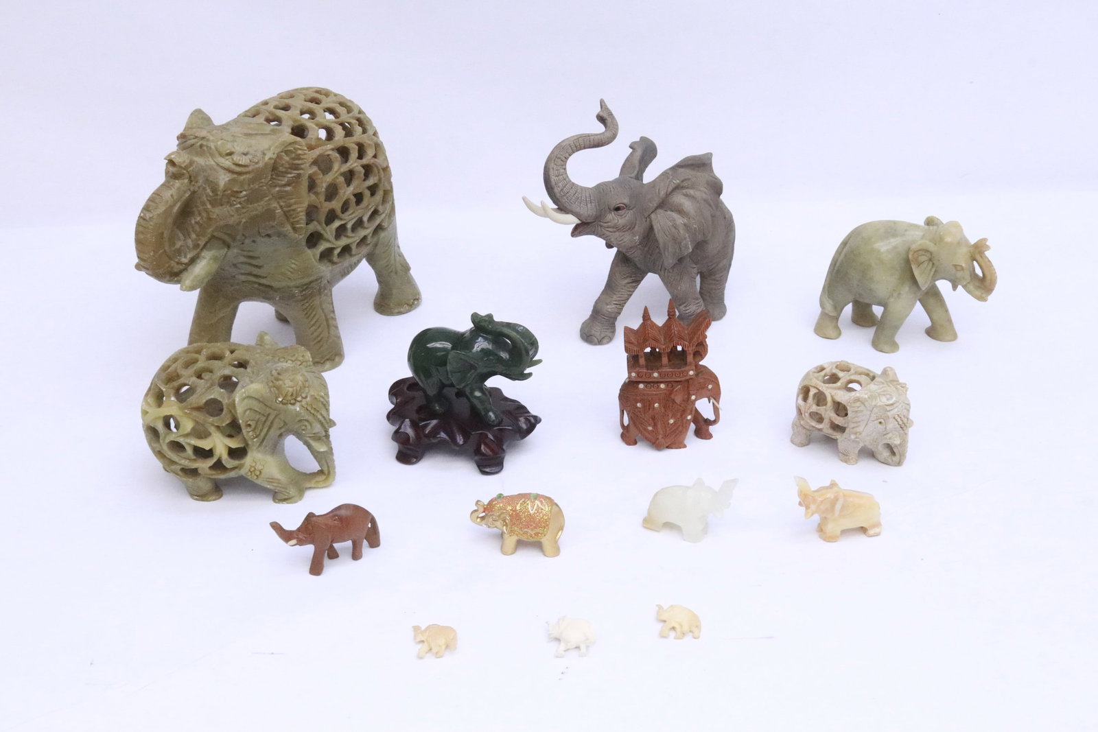 Lot of stone carved elephants: Lot of stone carved elephants; including a green jade carved example, 0.75"H - 6.15"H