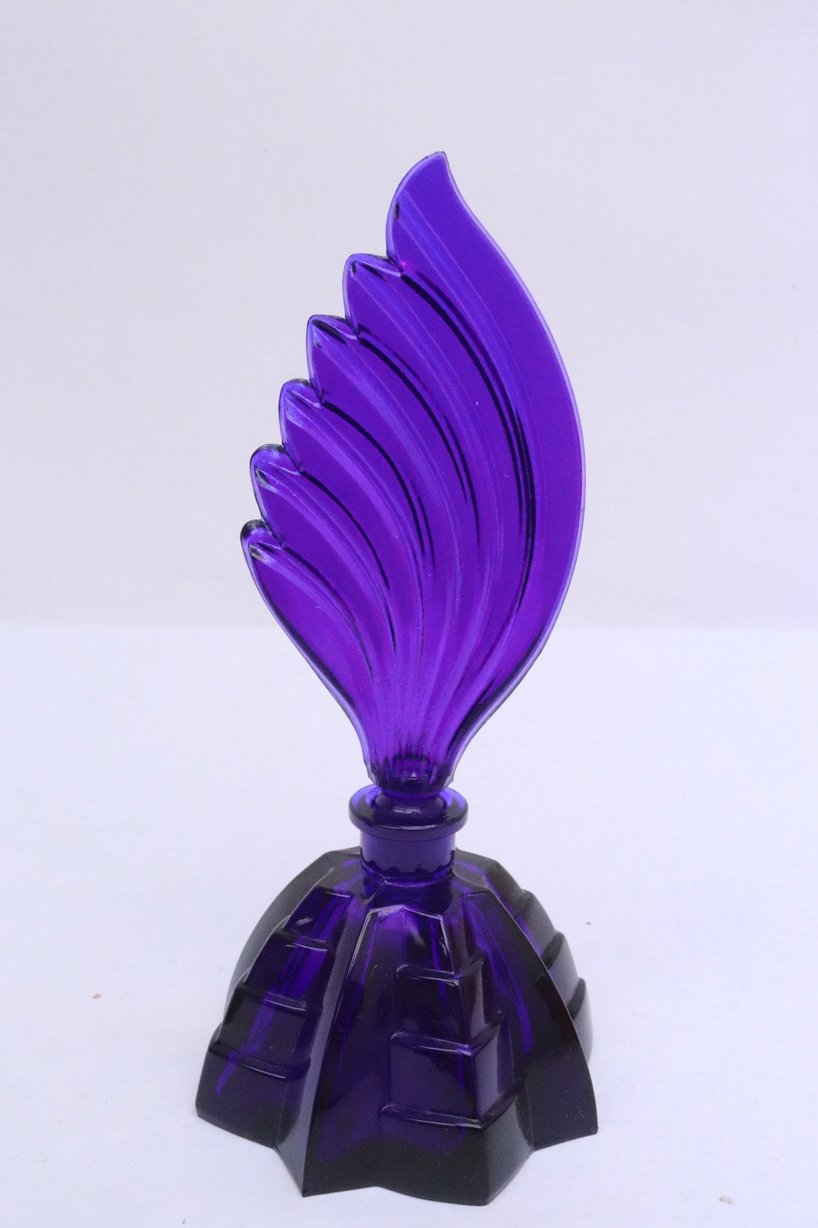 A Czech blue glass perfume bottle: A Czech blue glass perfume bottle, 7.2"x3.35"dia