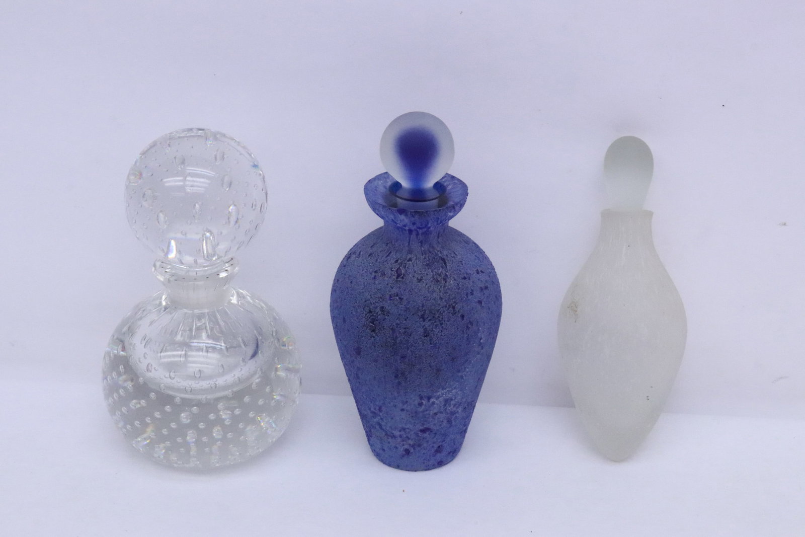 3 perfume bottles/ cologne bottles: 3 perfume bottles/ cologne bottles, 5.15"x2"dia - 5.65"x2.35"x2.65"