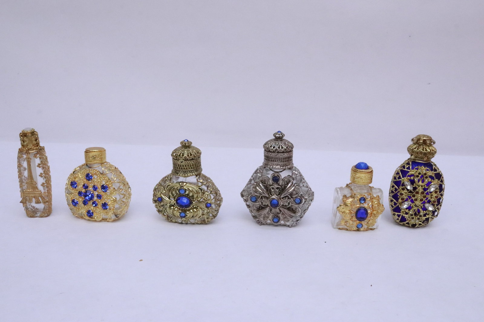 6 perfume bottles: 6 perfume bottles, 1.9"x1.2"x1.05" - 2.7"x2"x1.1"