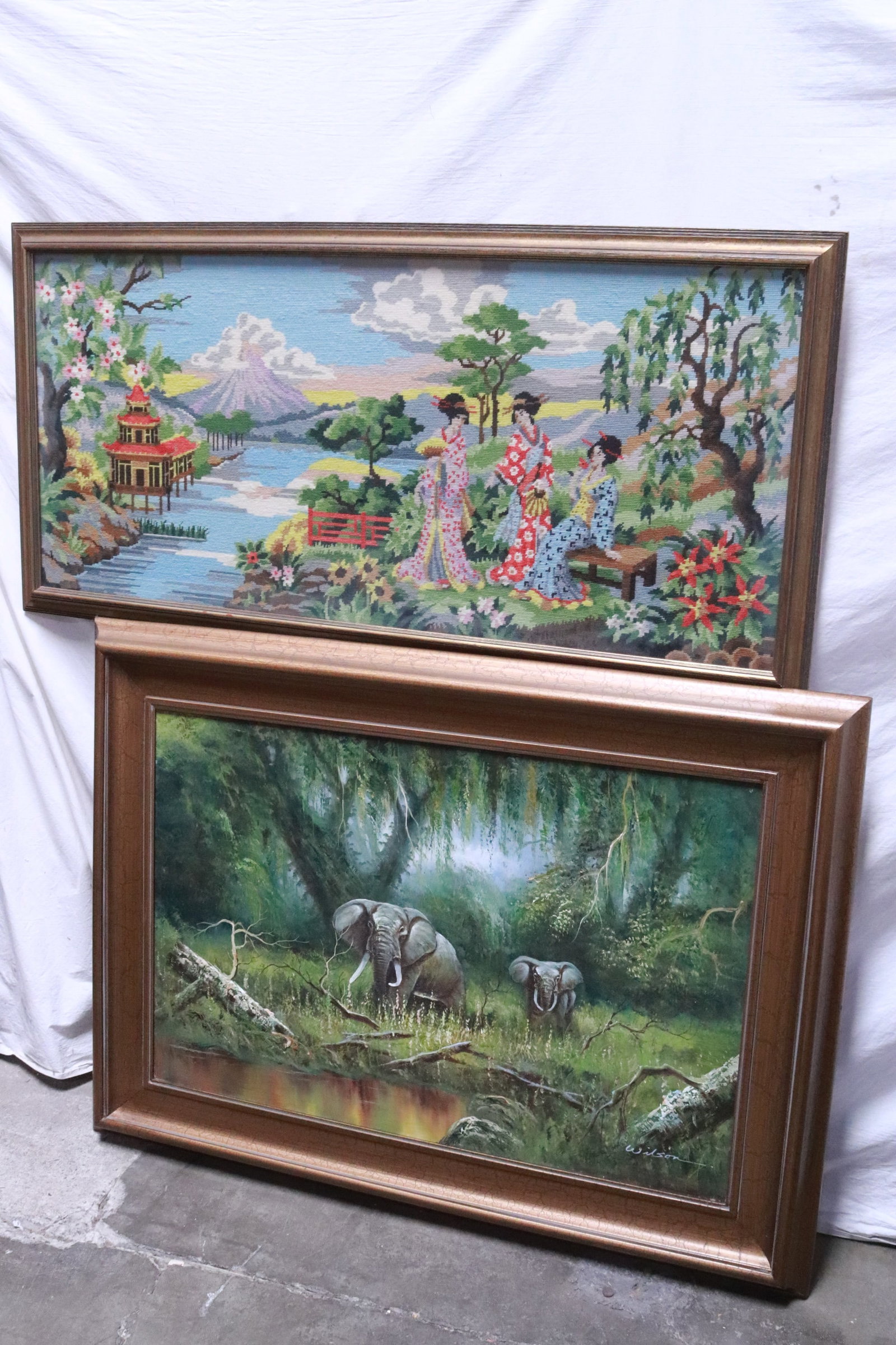 oil on canvas "elephant", and a framed needlepoint: 2 pieces art; oil on canvas "elephant" (23.5"x35.35" (F:33.35"x45.2"x2"), and a framed needlepoint (9.5"x44.6" (F:23.5"x48.3"x1.4"))