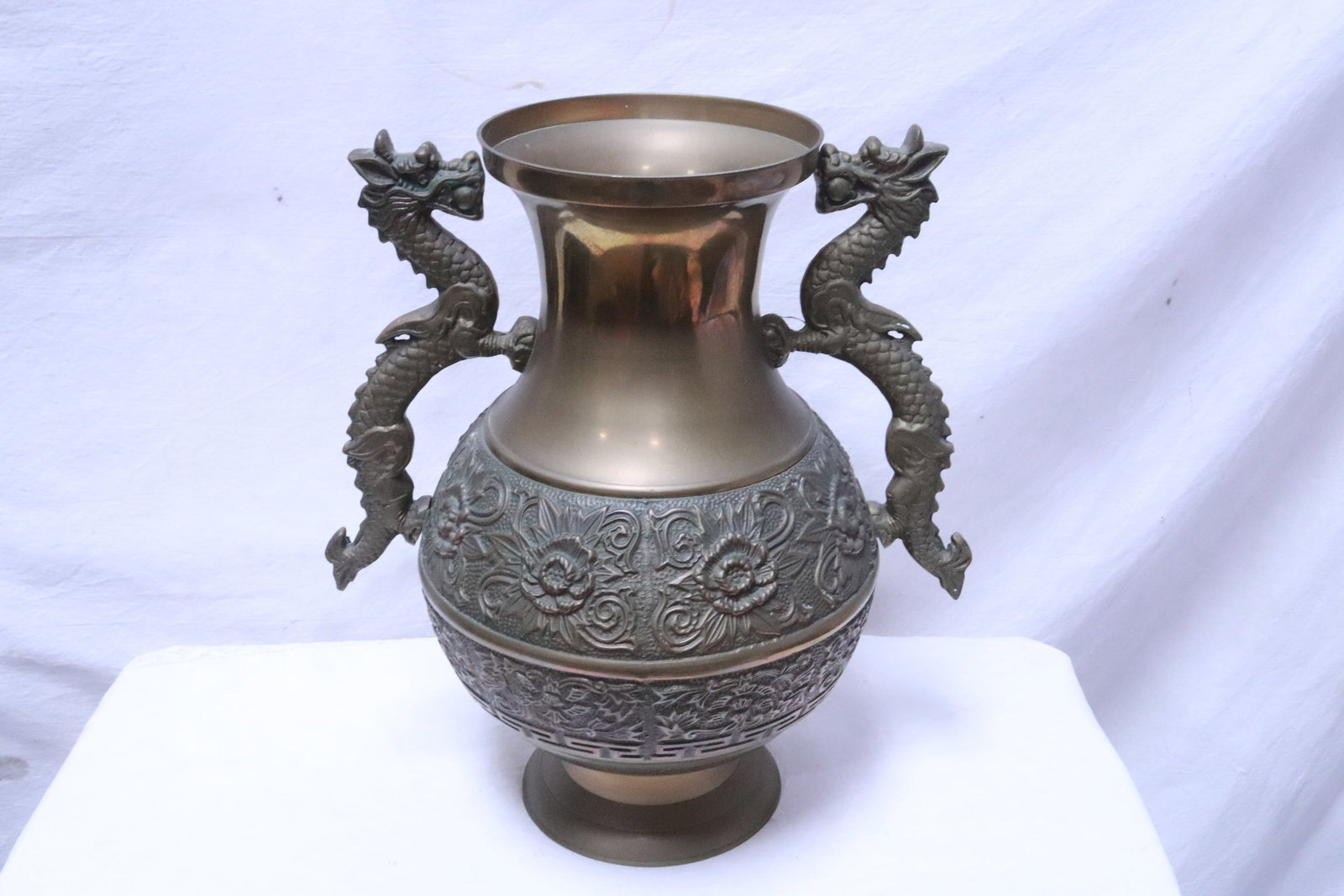 Large brass handled jar with decoration in relief: Large brass handled jar with decoration in relief, 16.35"x14.7"x10.4"