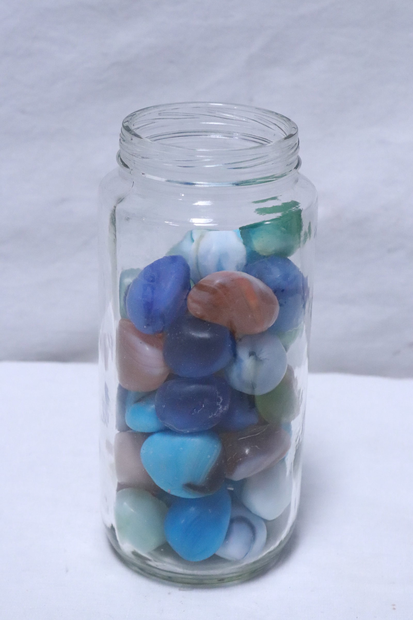 Jar of polished geo items: Jar (6.5"x2.8"dia) of polished geo items