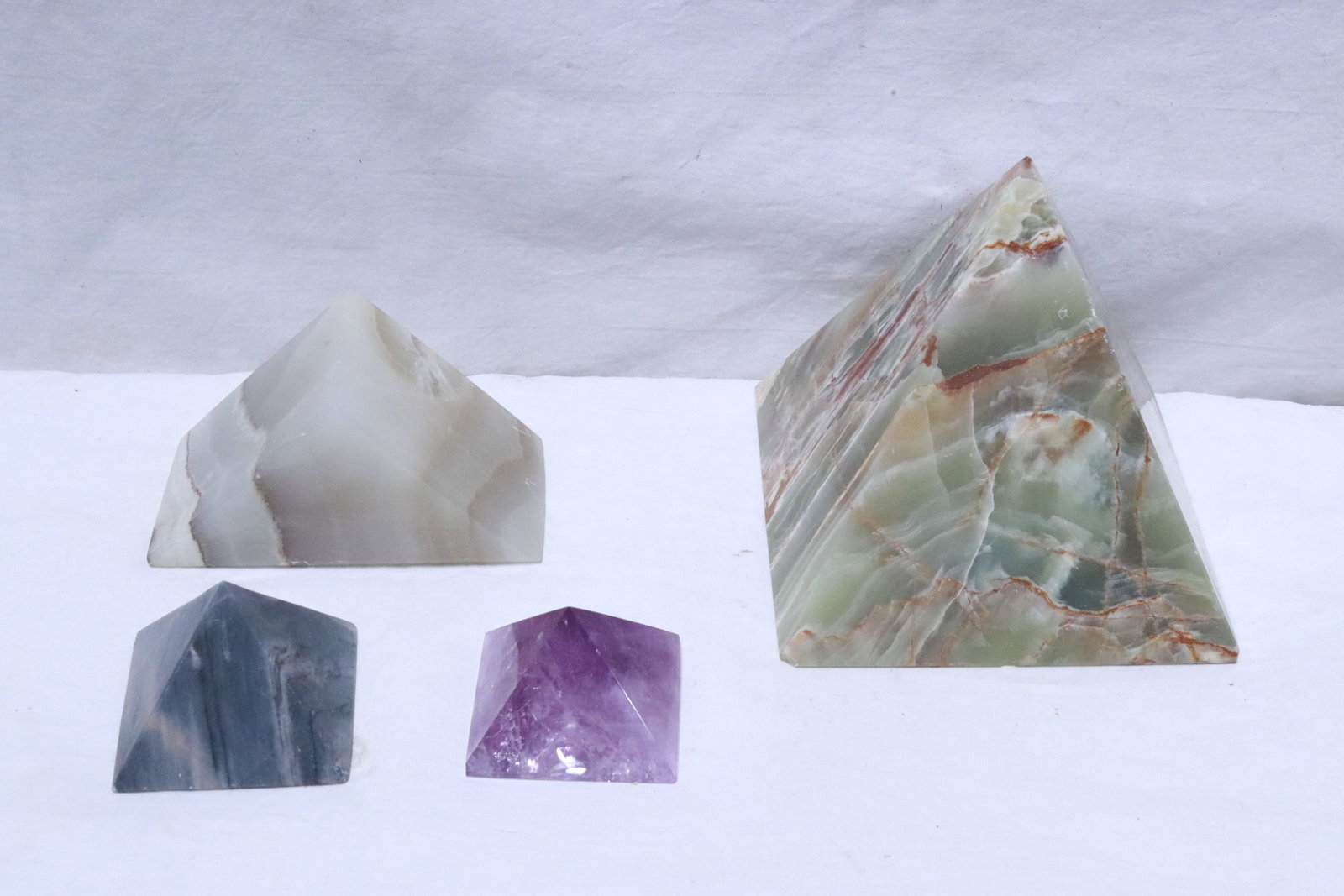 3 onyx points, and one amethyst point: 3 onyx points, and one amethyst point, 1.7"x2.6"x2.5" - 5.8"x5.9"x5.9"
