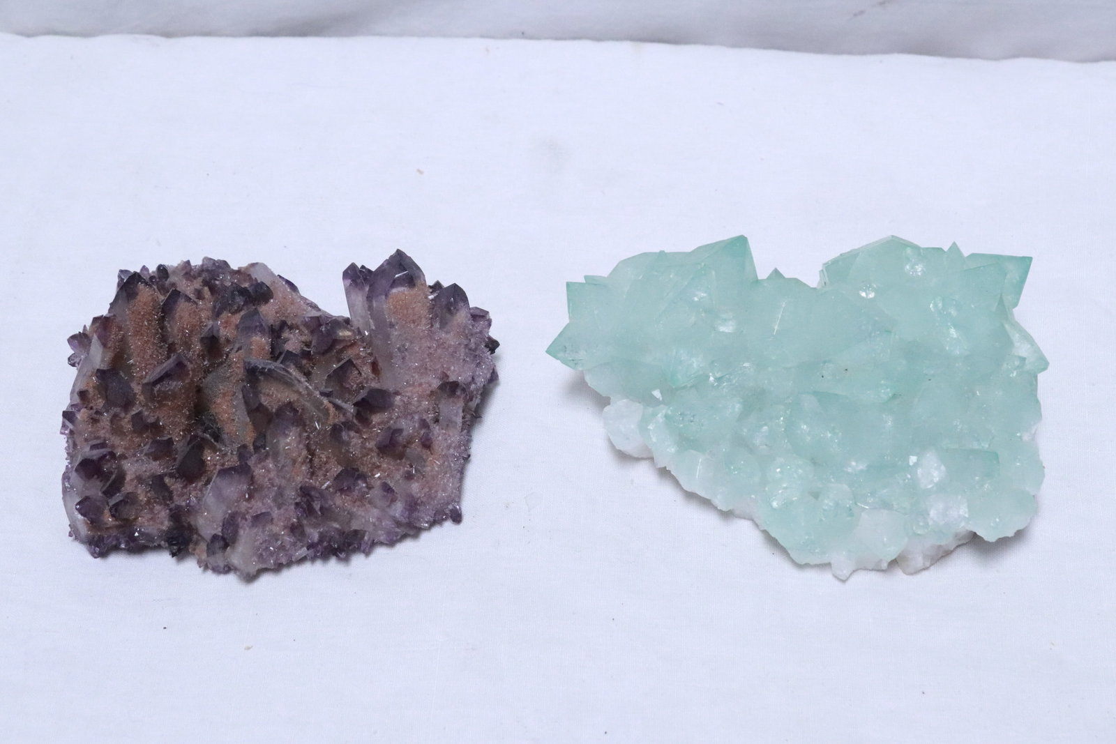 2 crystal clusters: 2 pieces; a green apophyllite crystal cluster (2.2"x4.8"x3.4"), and a purple amethyst phantom crystal cluster (1.9"x4.4"x3.8")