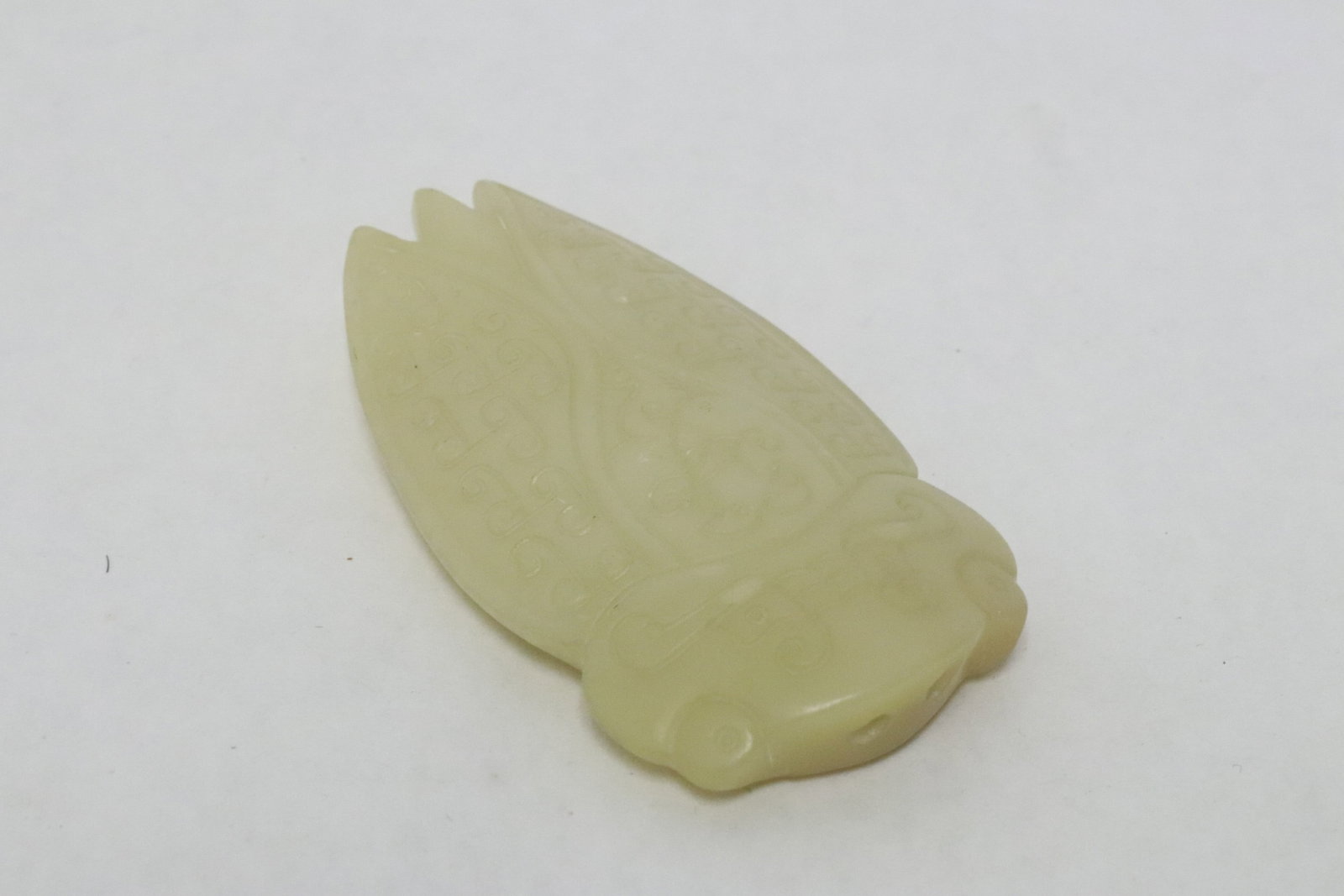 A jade like stone carved cicada: A jade like stone carved cicada, 2.8"x1.65"x0.6"