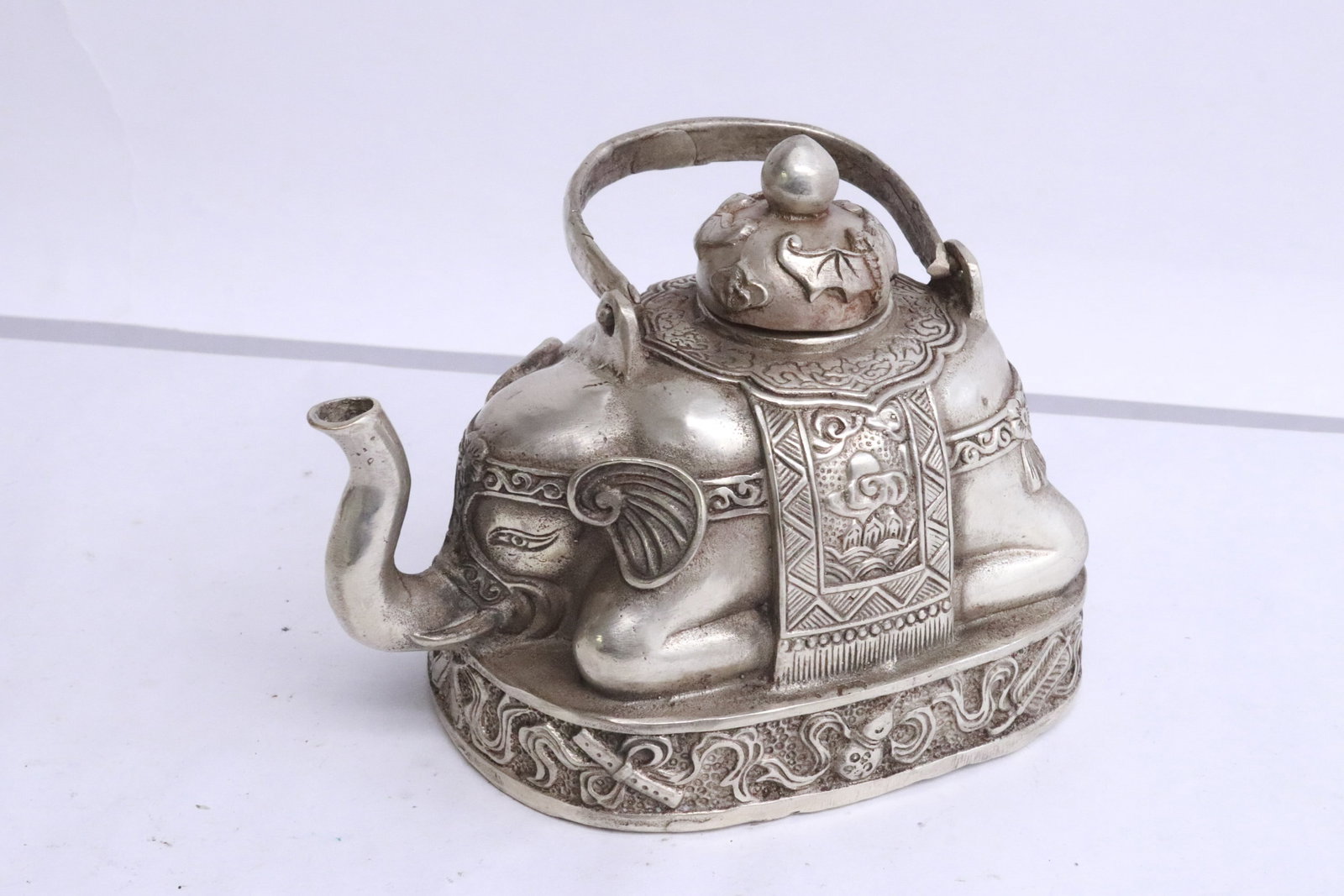 White bronze teapot in the form of elephant: White bronze teapot in the form of elephant, 4.15"x5.3"x3.35"